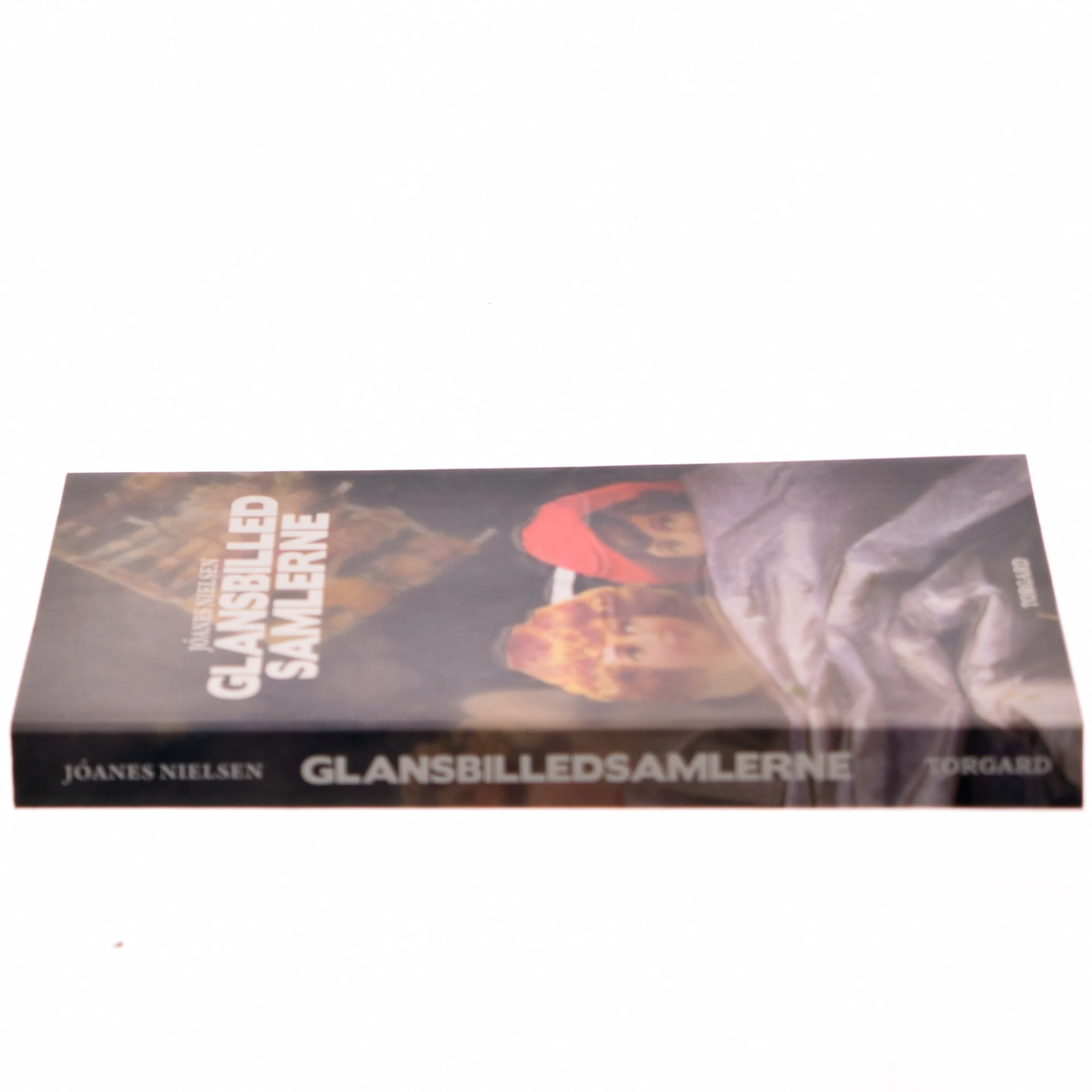 Glansbilledsamlerne : roman af Jóanes Nielsen (f. 1953) (Bog)