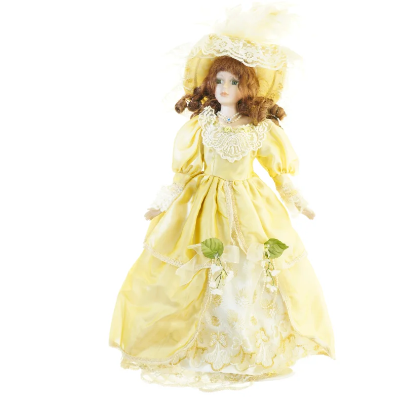 Dukke i gul kjole (str. 54 x 27 cm)