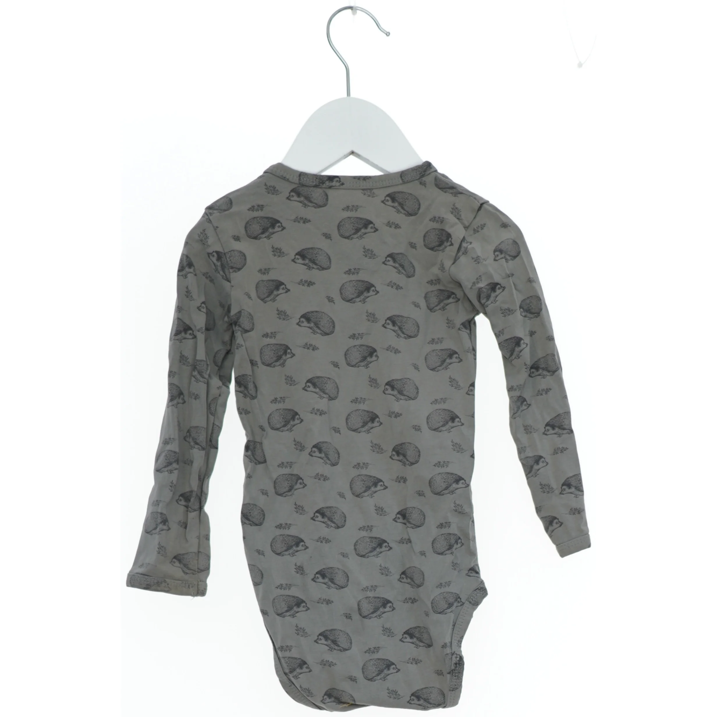 Langærmet bodystocking med pindsvinemønster fra Petit (str. 86)