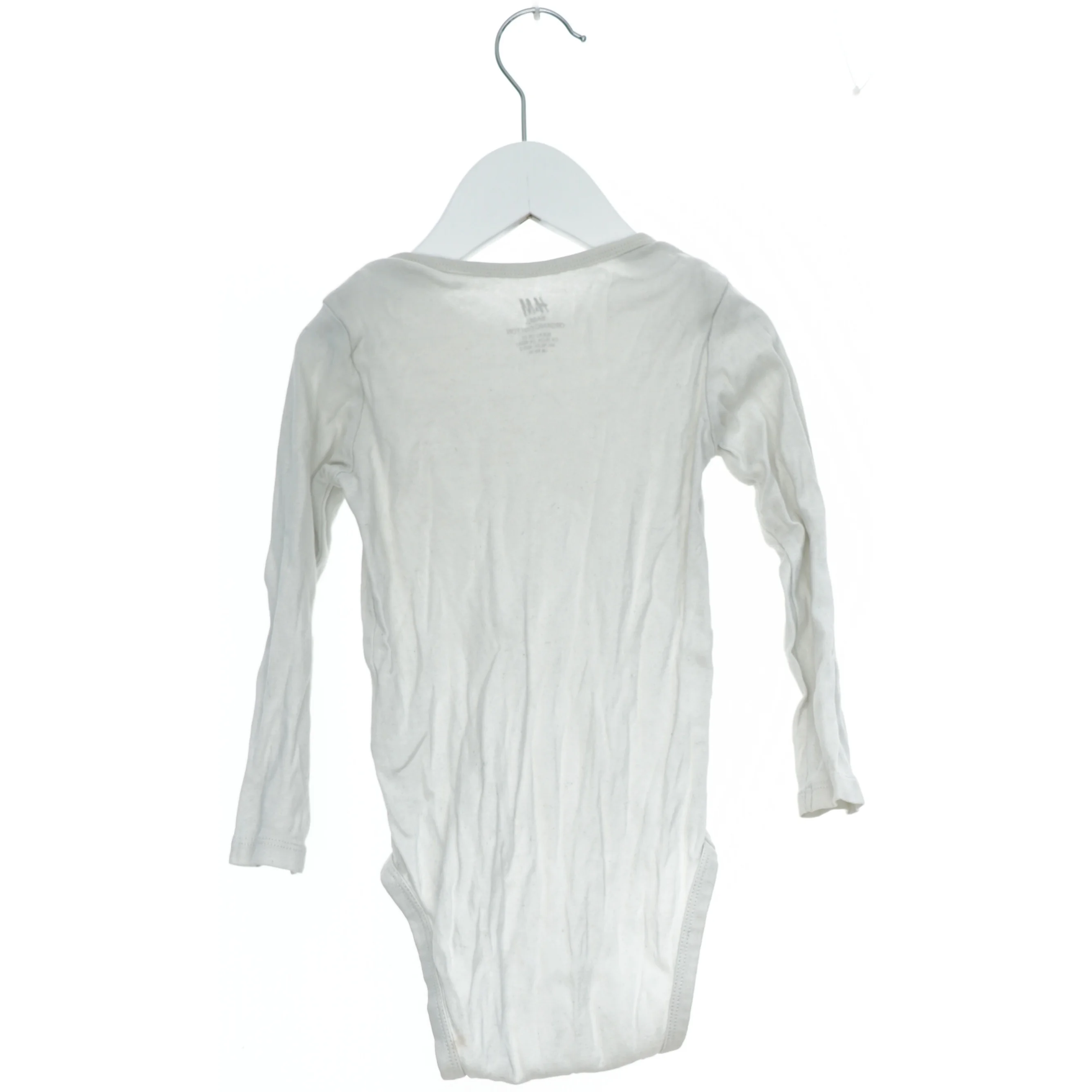 Hvid langærmet bodystocking fra H&M (str. 92)