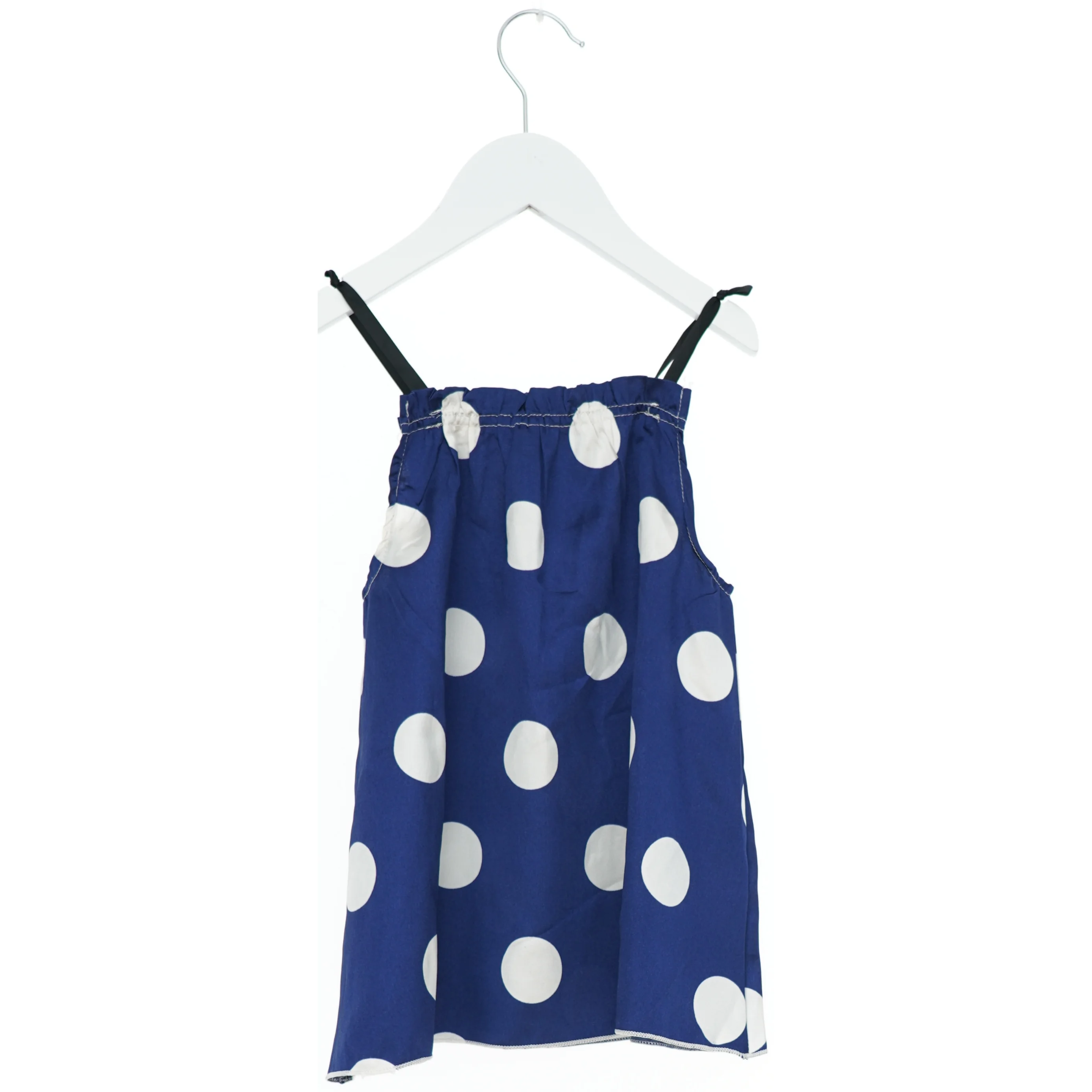 Blå kjole med store hvide prikker (str. 110)