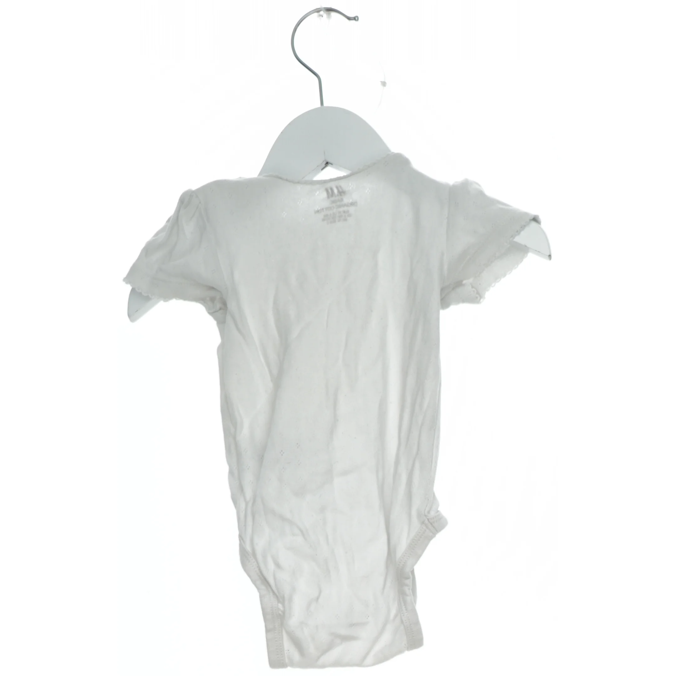 Hvid bodystocking til baby fra H&M (str. 74)