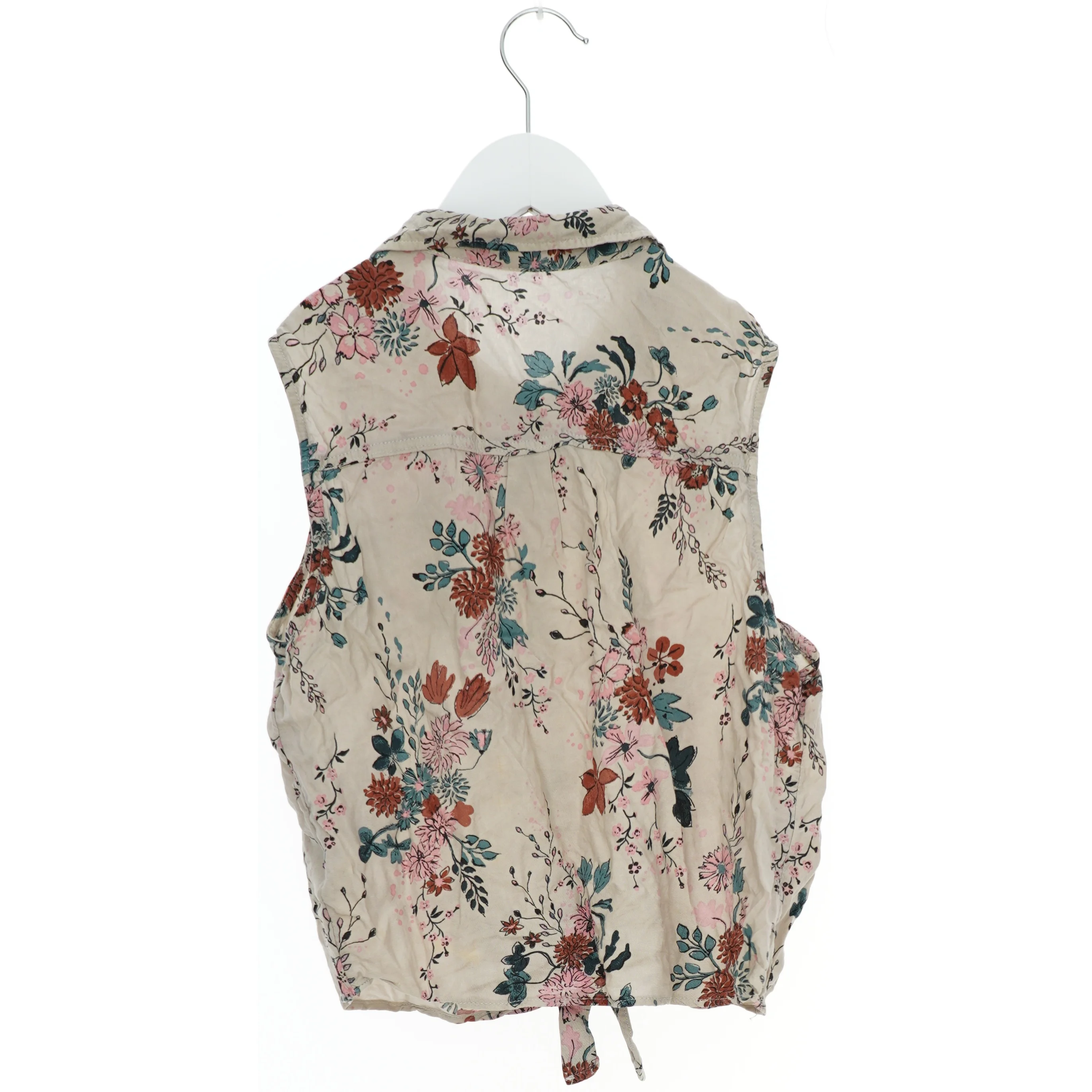 Bluse uden ærmer med blomstermønster fra H&M (str. 164)