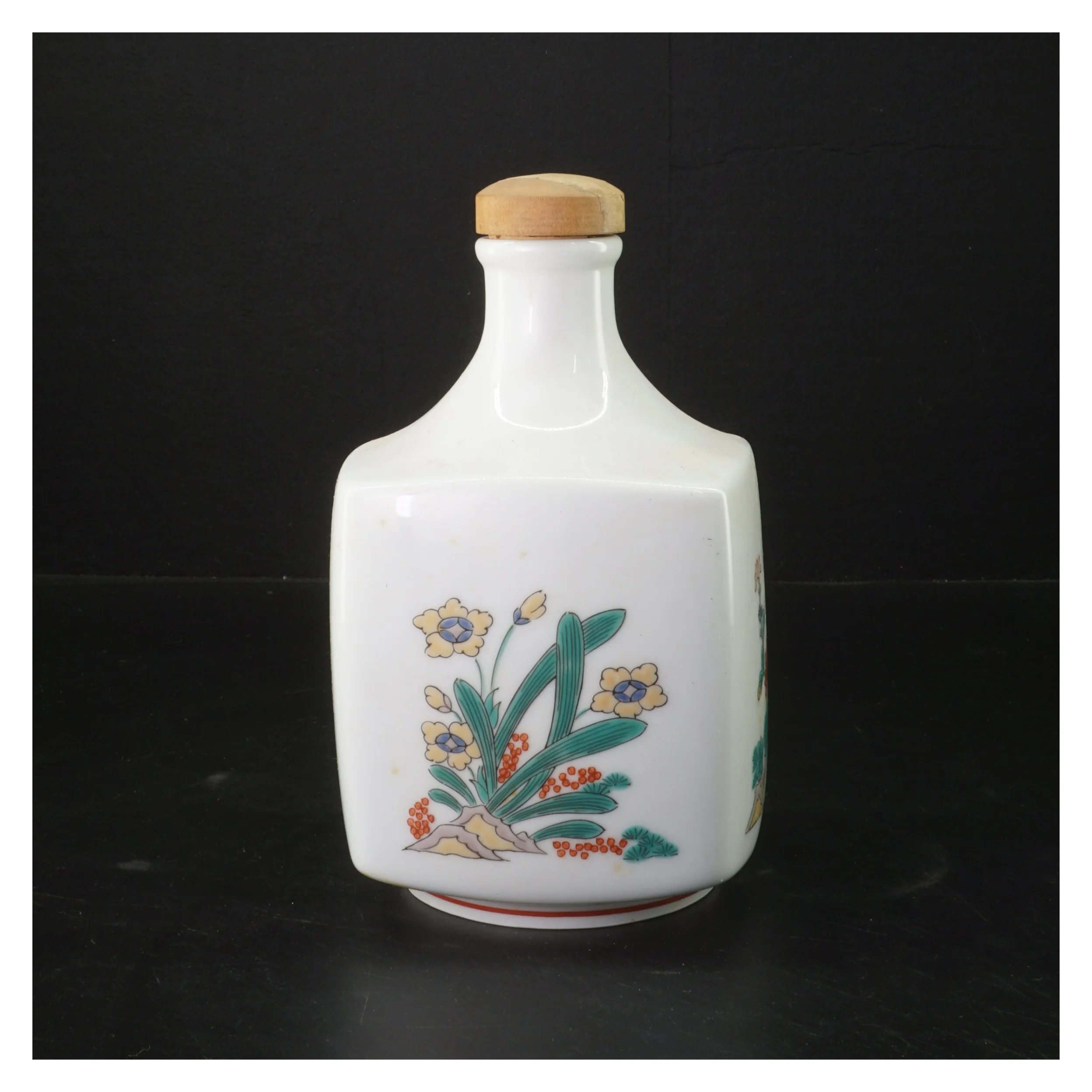 Porcelænsflaske med korklåg og blomstermotiv (str. 20 cm)