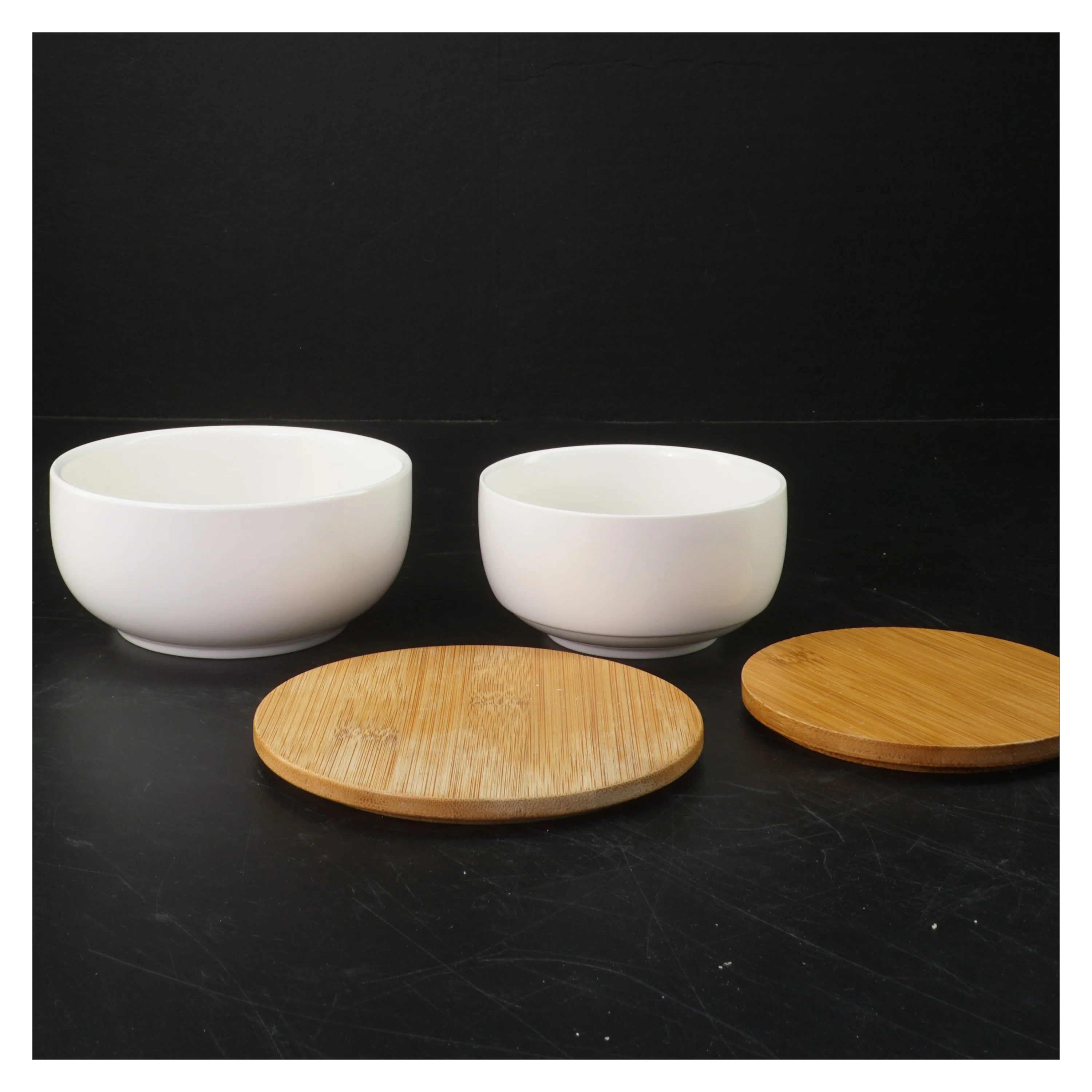 Sæt af to opbevaringsskåle med trælåg fra Anna & Clara (str. Ø. 10,5 cm. og. ø. 13 cm)