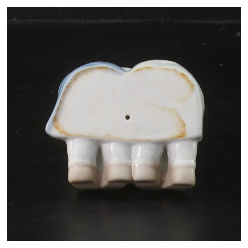 Porcelænsfigur af børn der læser (str. 8x6x9 cm)