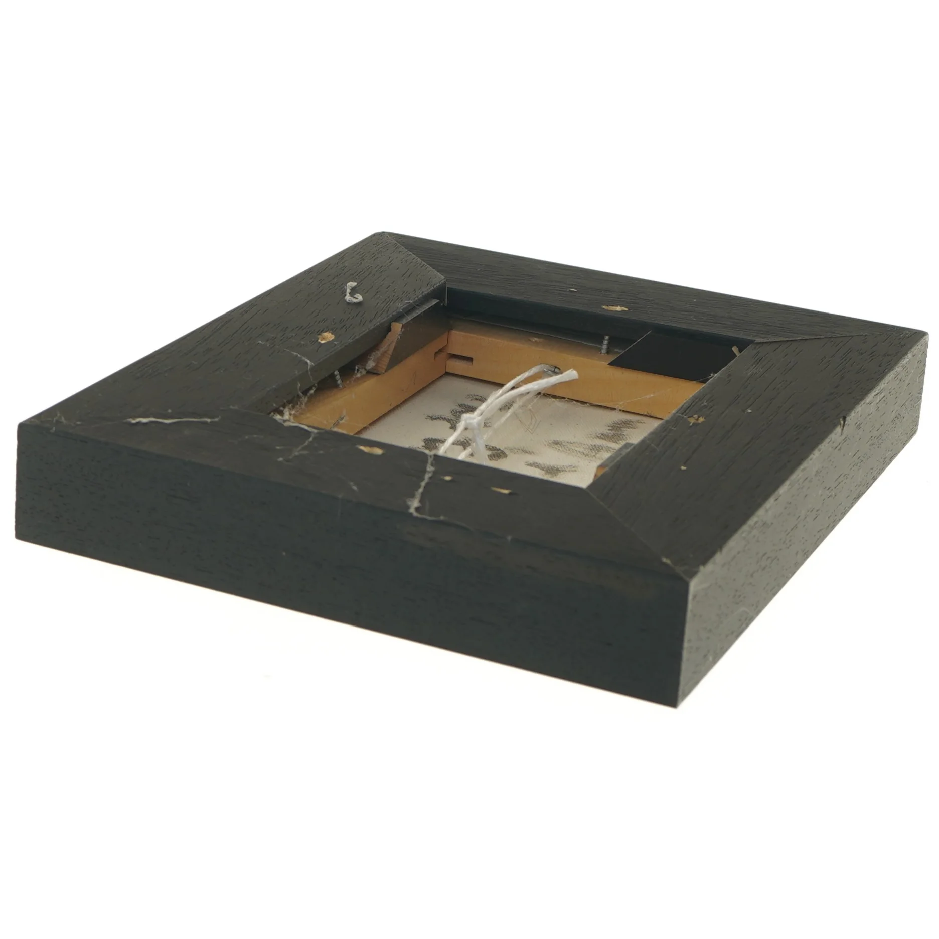 Maleriet i sort ramme (str. 22x4x27 cm)