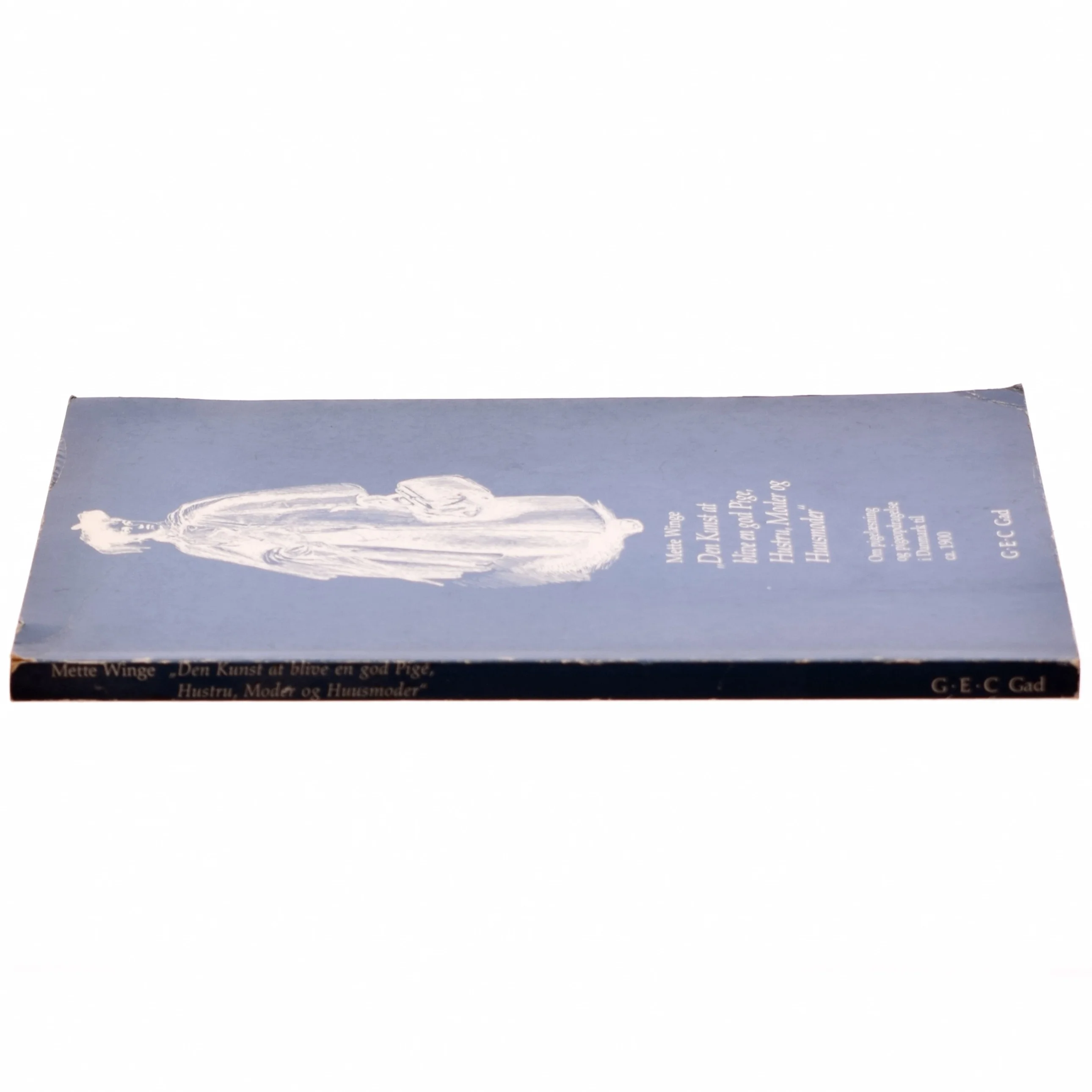 Den kunst at blive en god pige, hustru, moder og husmoder af Mette Winge (bog)