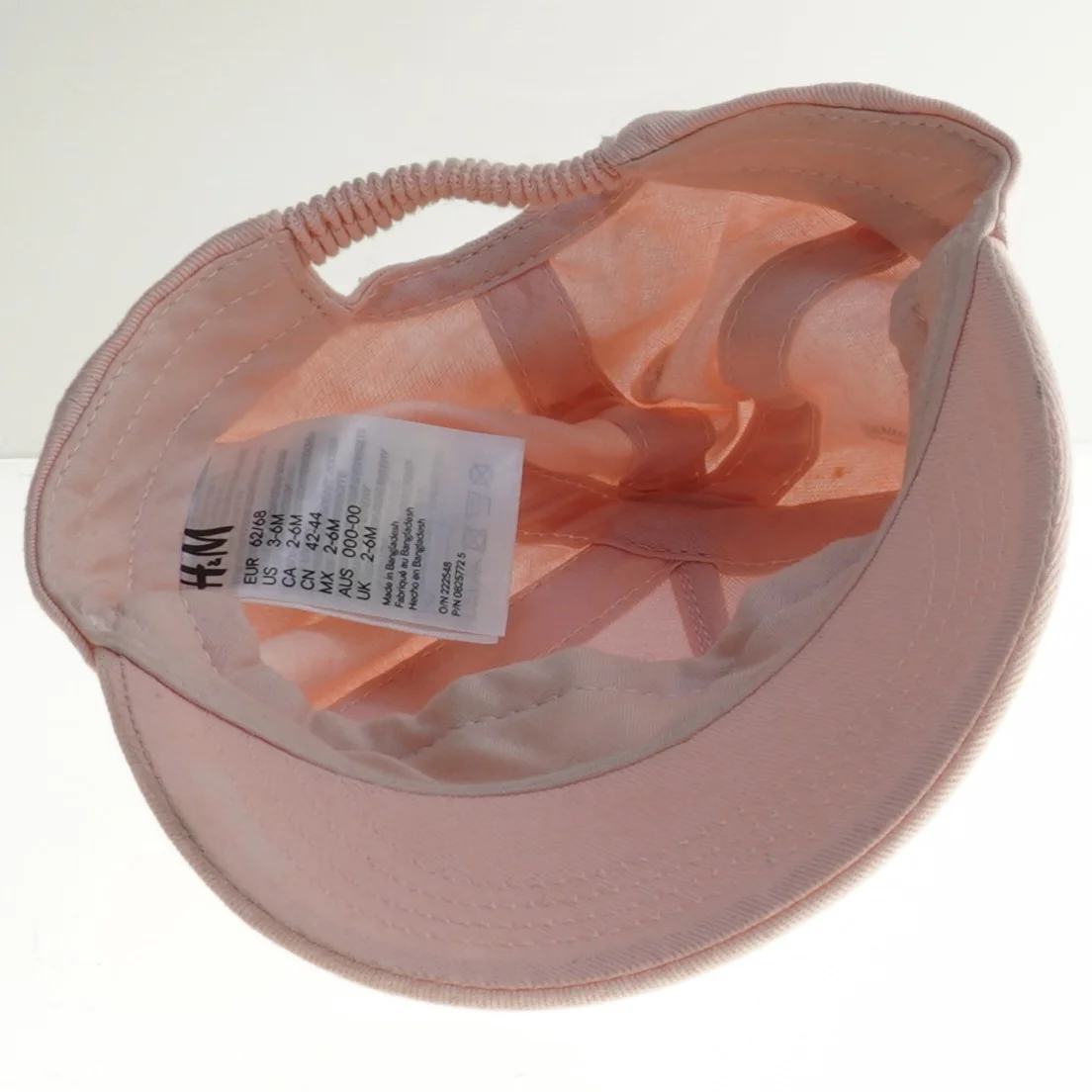 Lyserød kasket fra H&M (str. 68)