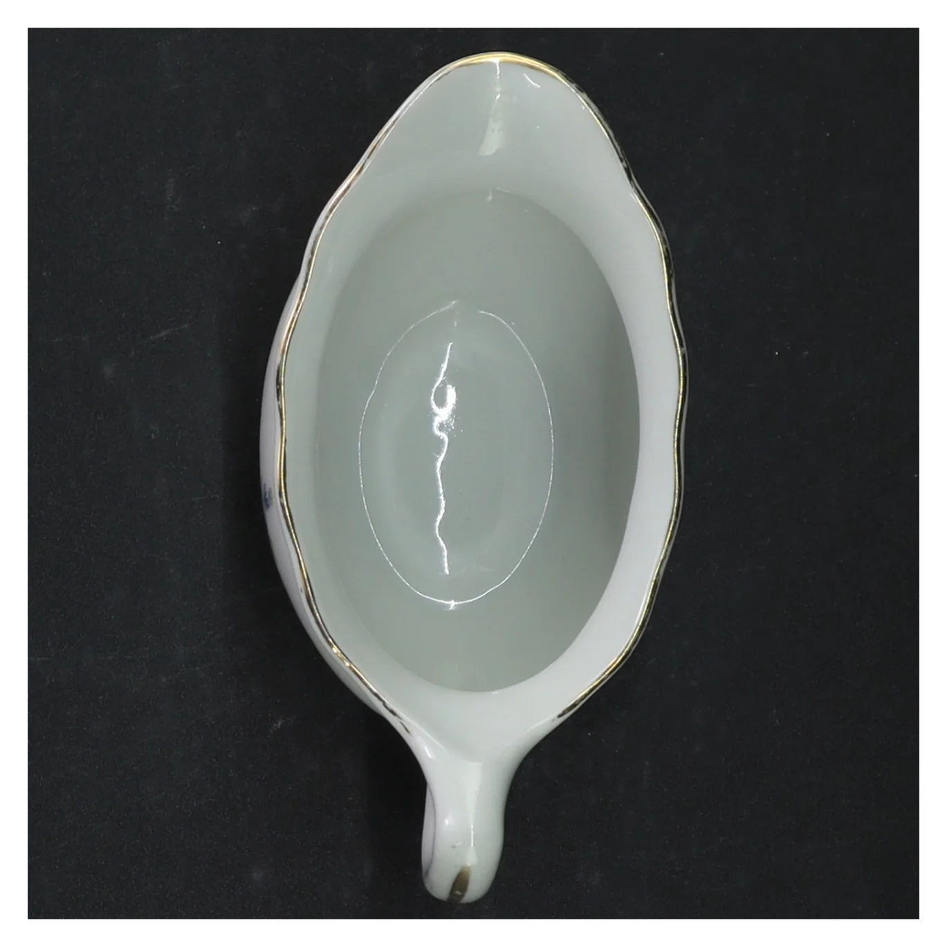 Porcelæn saucebåd med blomstermotiv