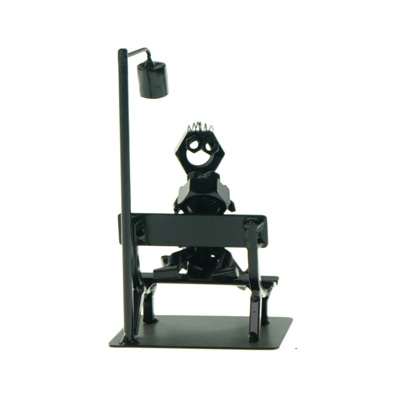 Figur på bænk (str. LBH: 10x8x18 cm)