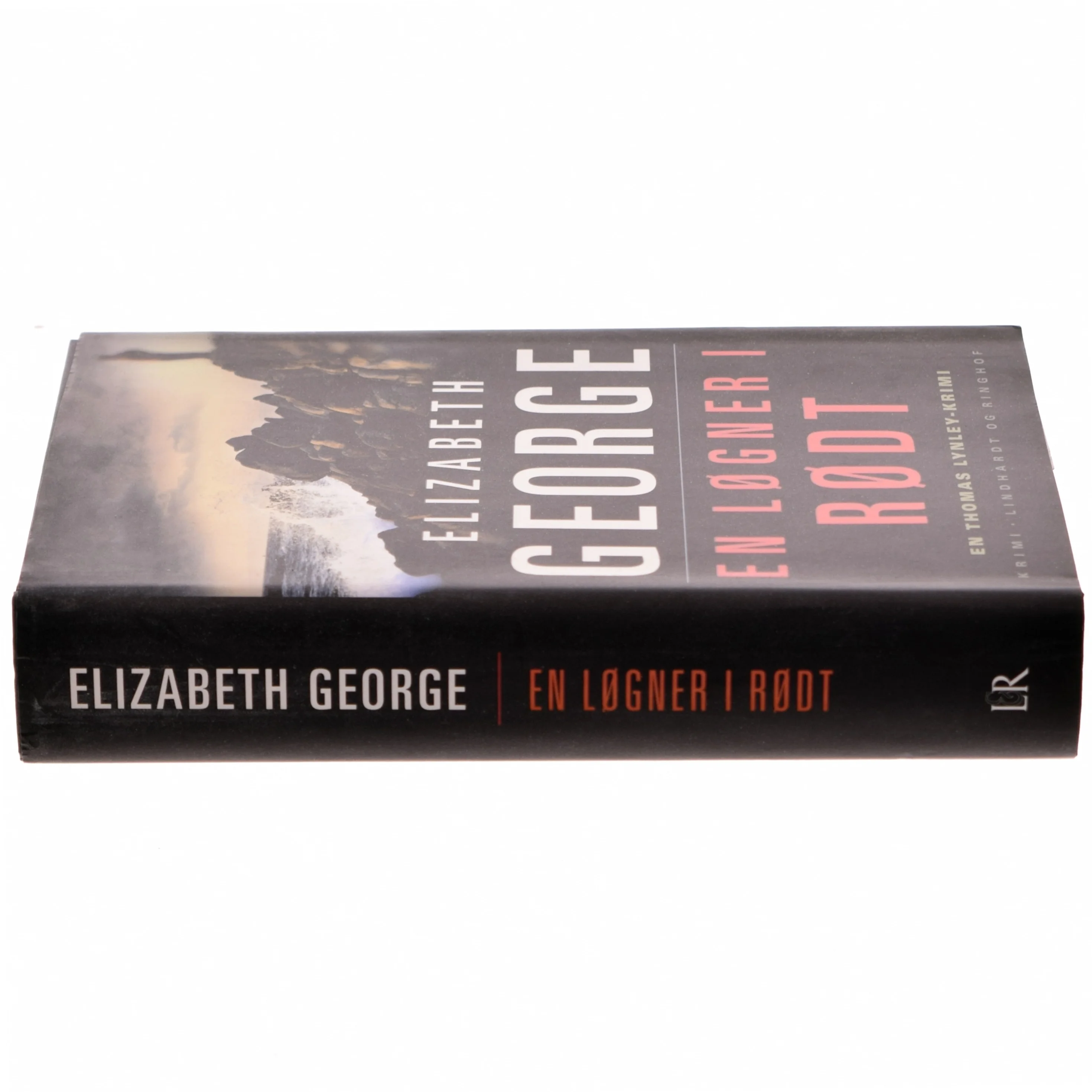 En løgner i rødt af Elizabeth George (Bog)