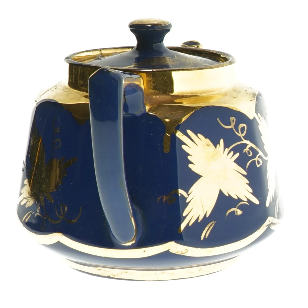 Blå tekande med gulddekorationer (str. 20 cm)