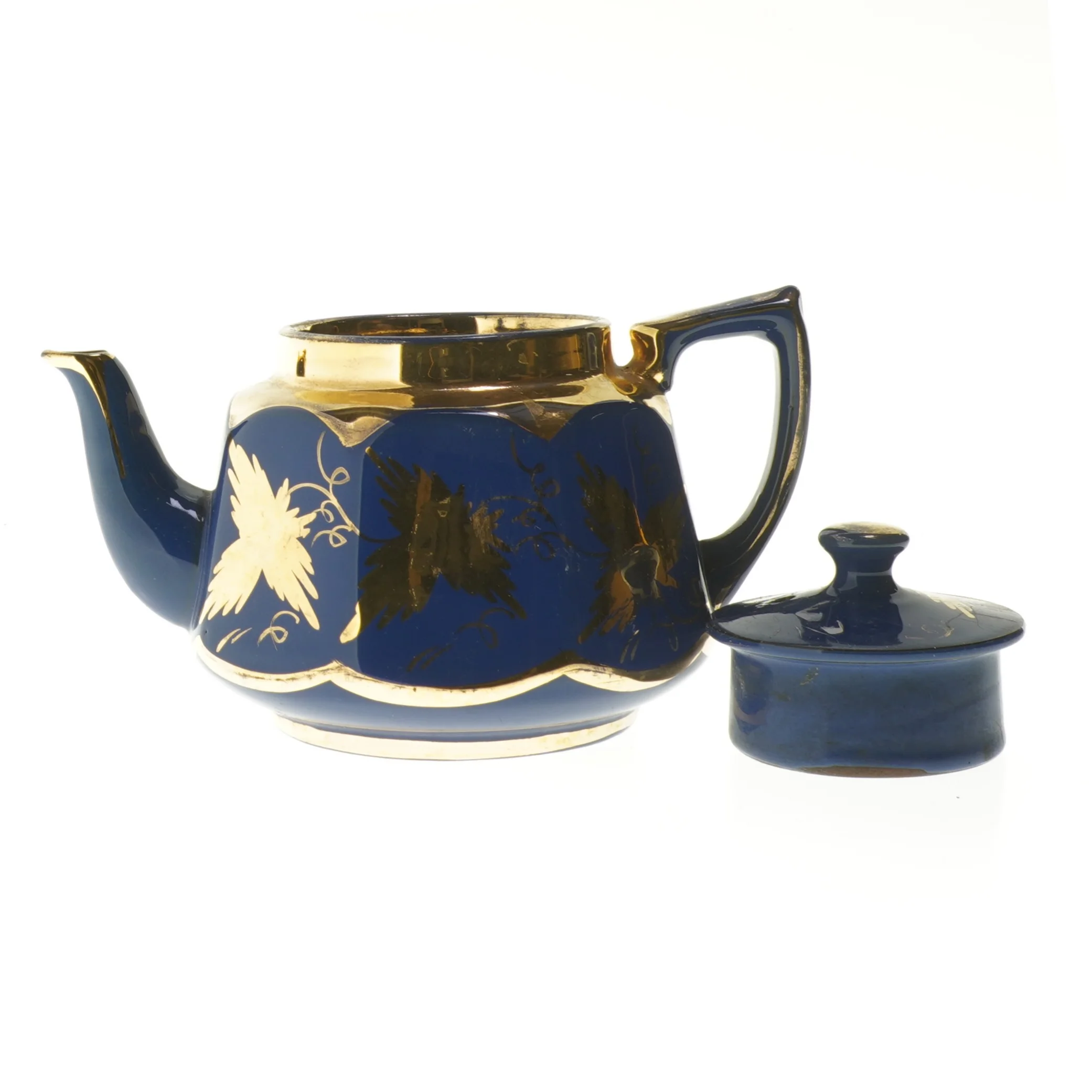 Blå tekande med gulddekorationer (str. 20 cm)