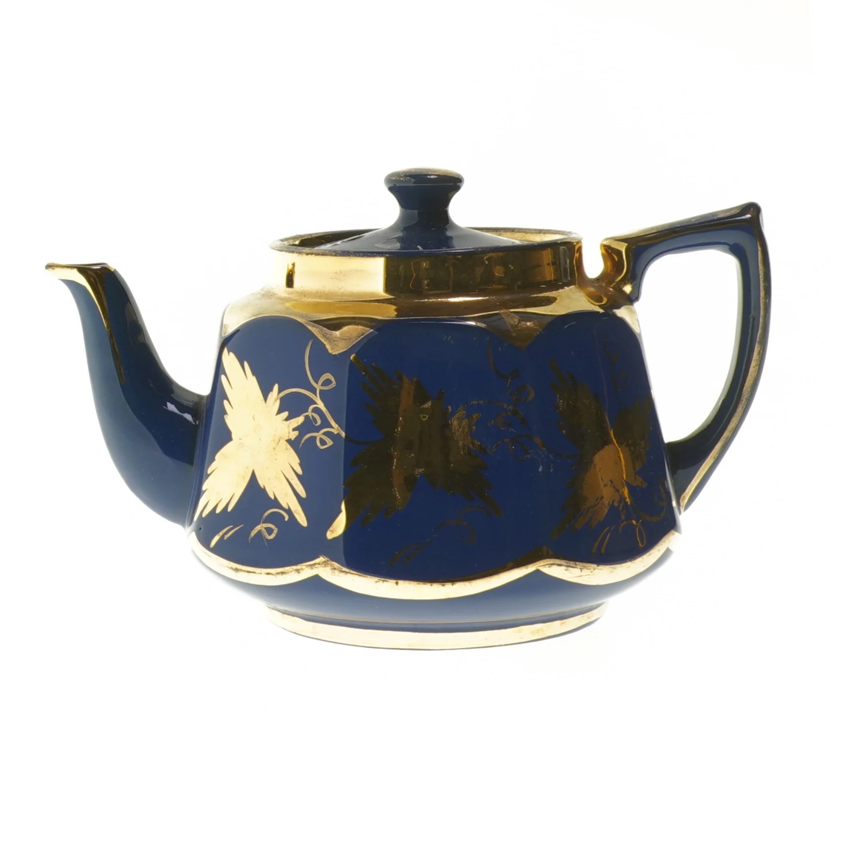 Blå tekande med gulddekorationer (str. 20 cm)