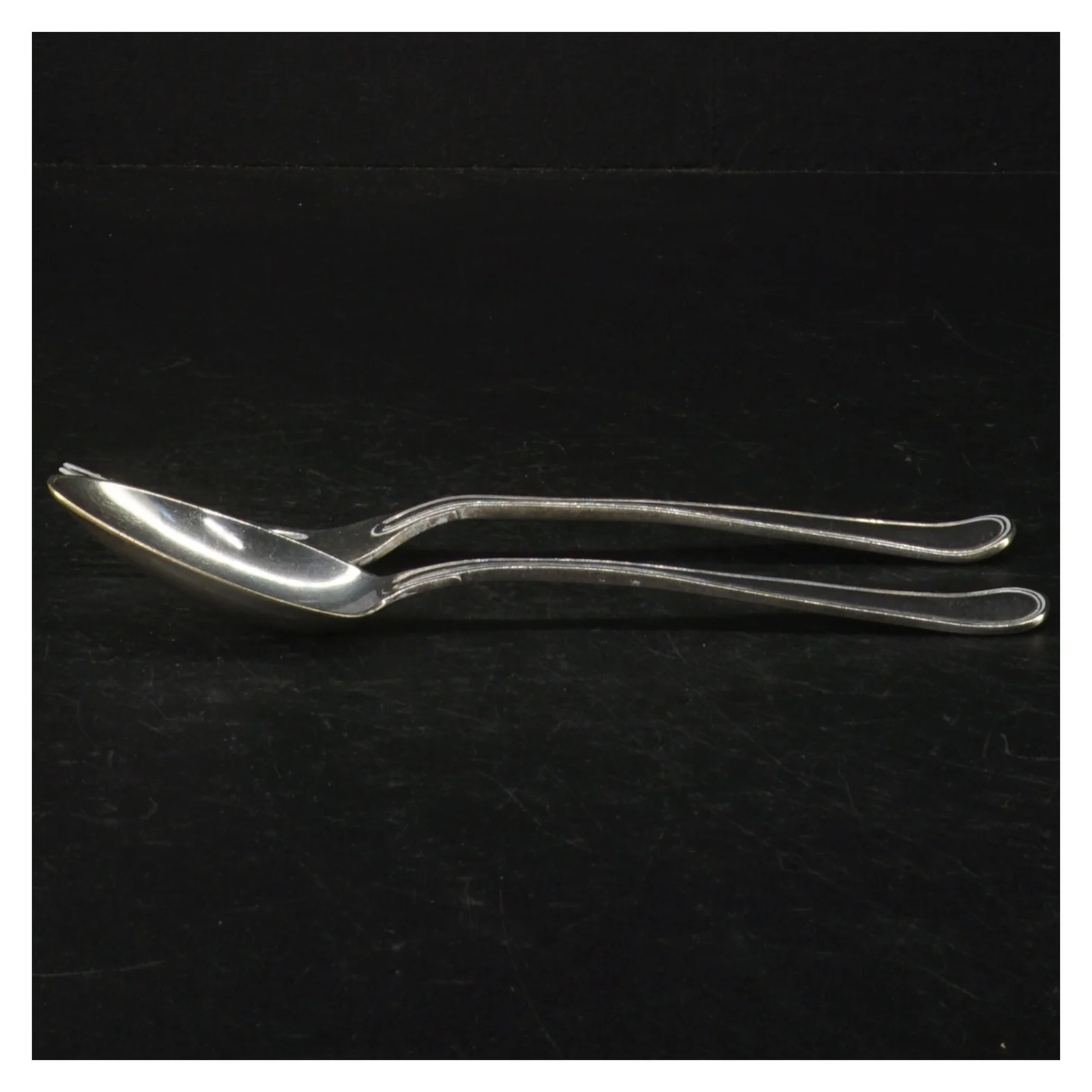 Sølvbestik dobbelt riflet.