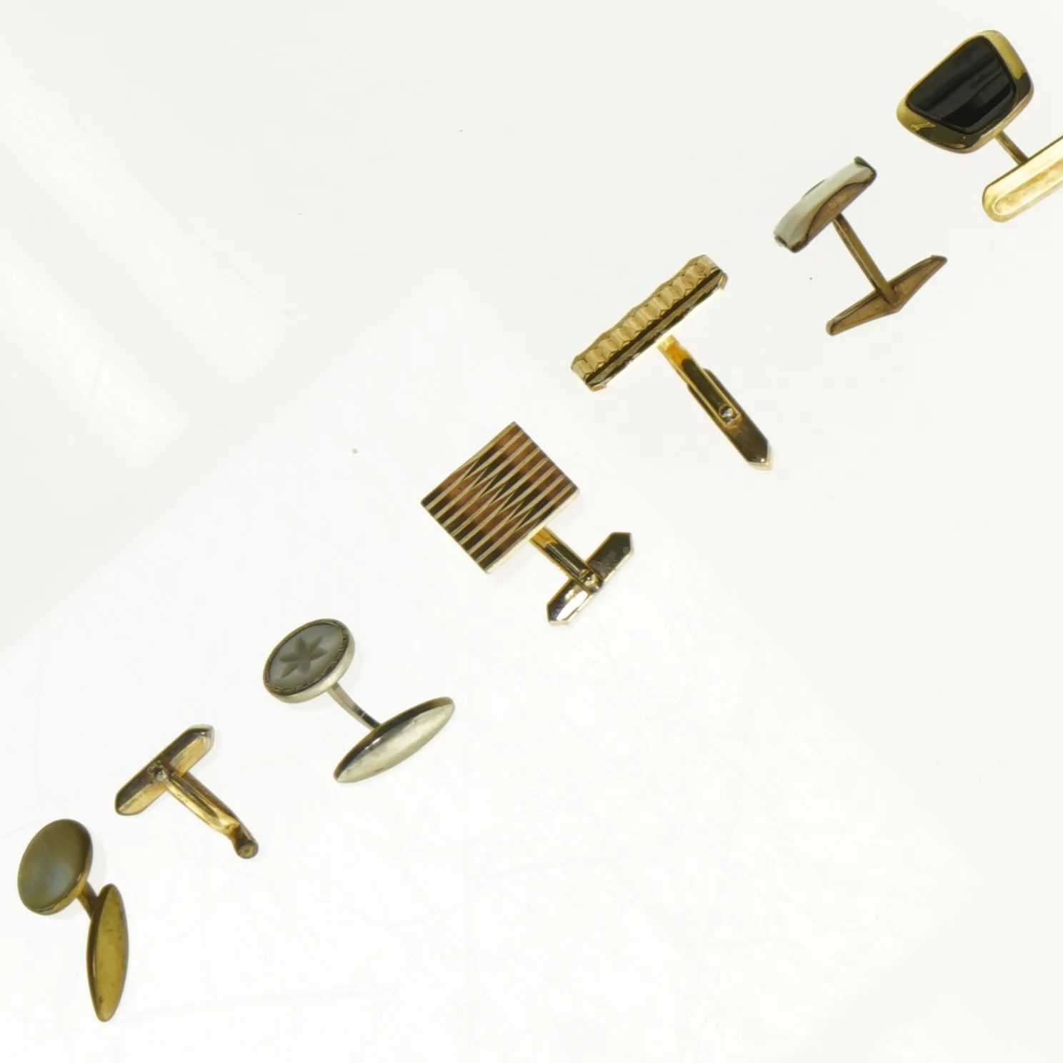 Manchetknapper i blandet design