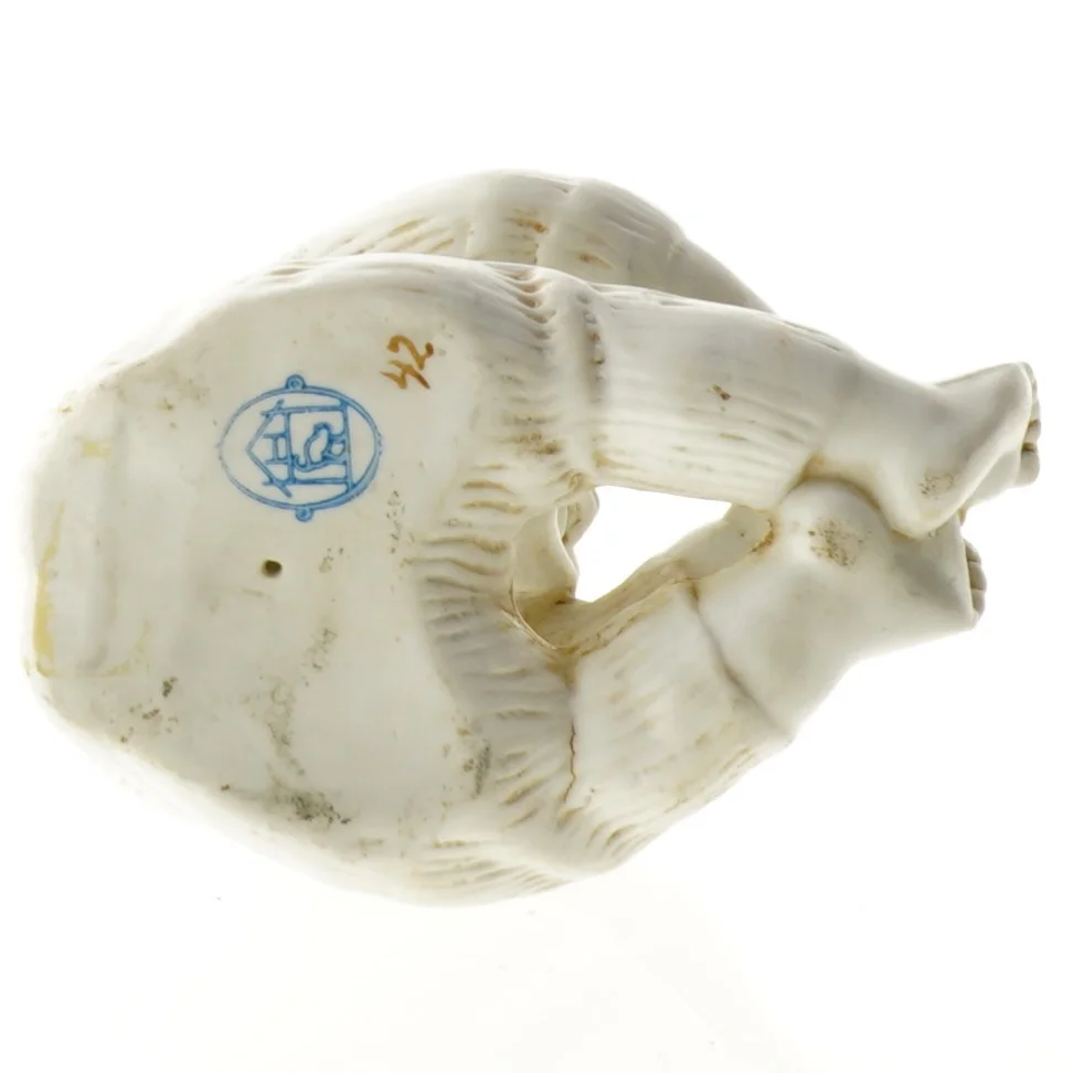 Porcelænsfigur af baby (str. 12 x 6 cm)