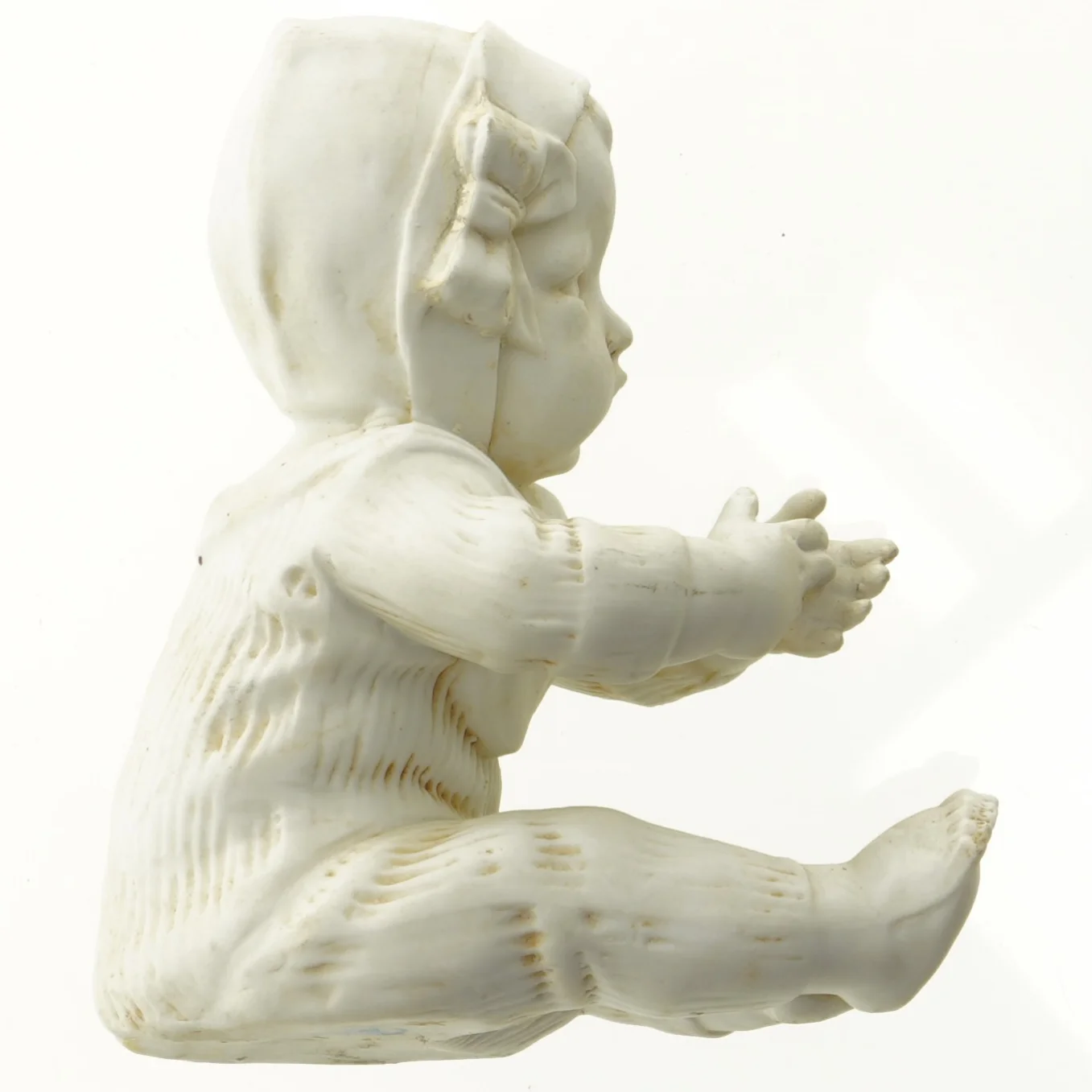 Porcelænsfigur af baby (str. 12 x 6 cm)