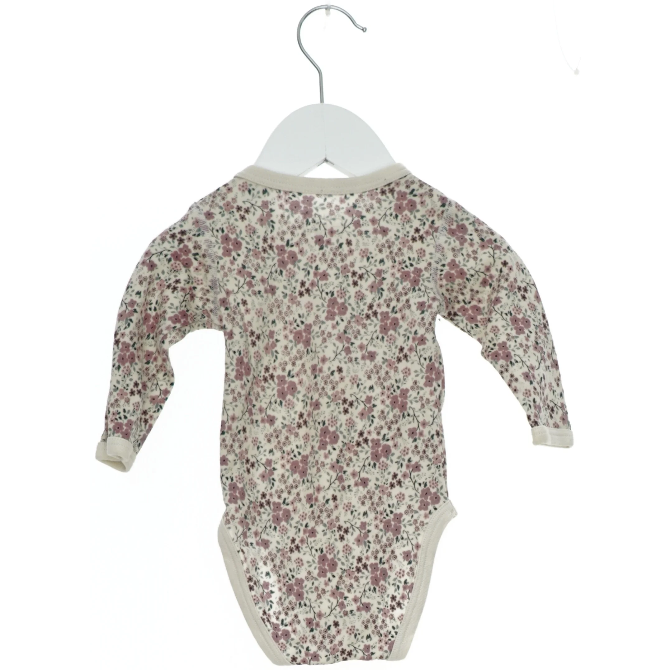 Langærmet bodystocking med blomsterprint fra Hust & Claire (str. 62)