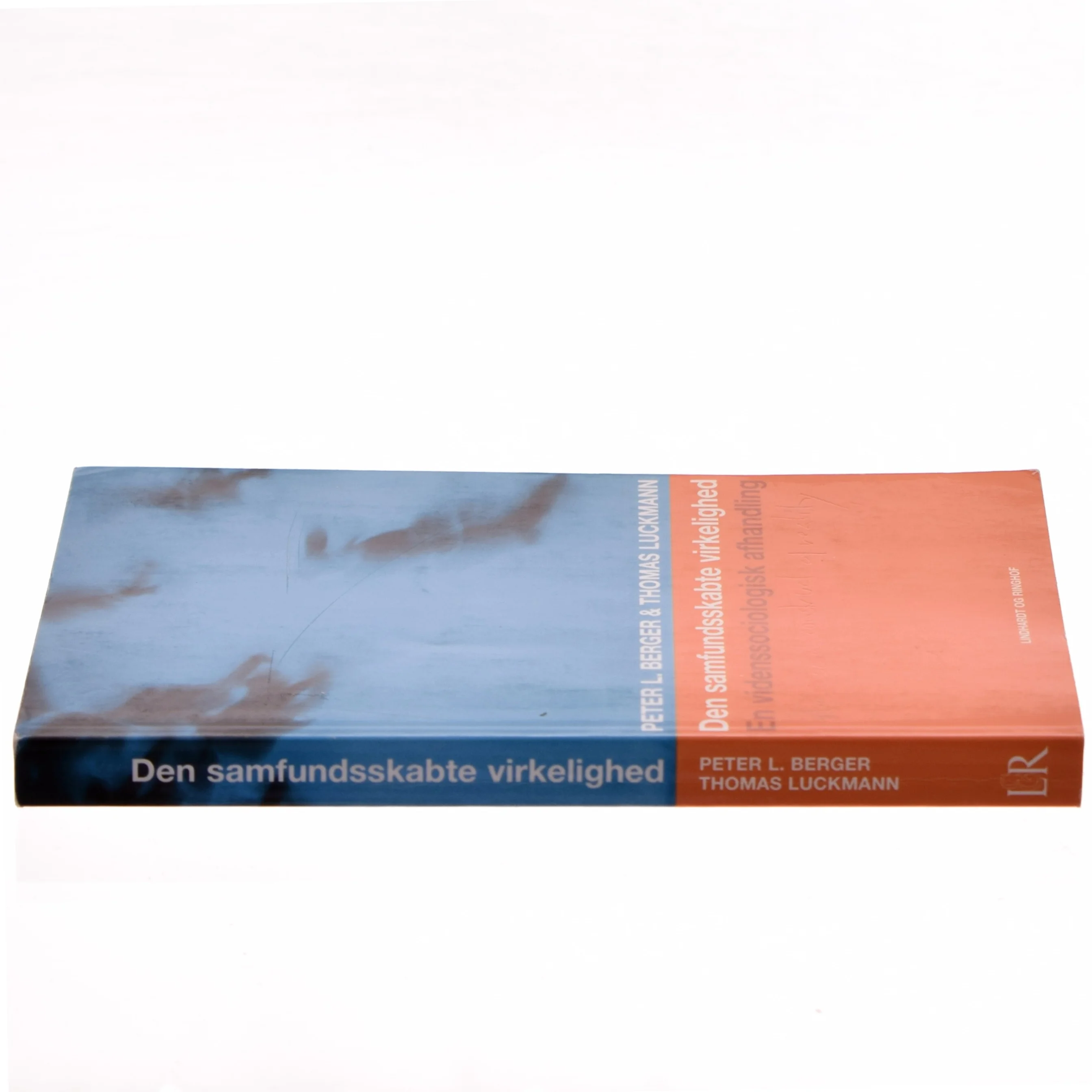 Den samfundsskabte virkelighed : en videnssociologisk afhandling (Bog)