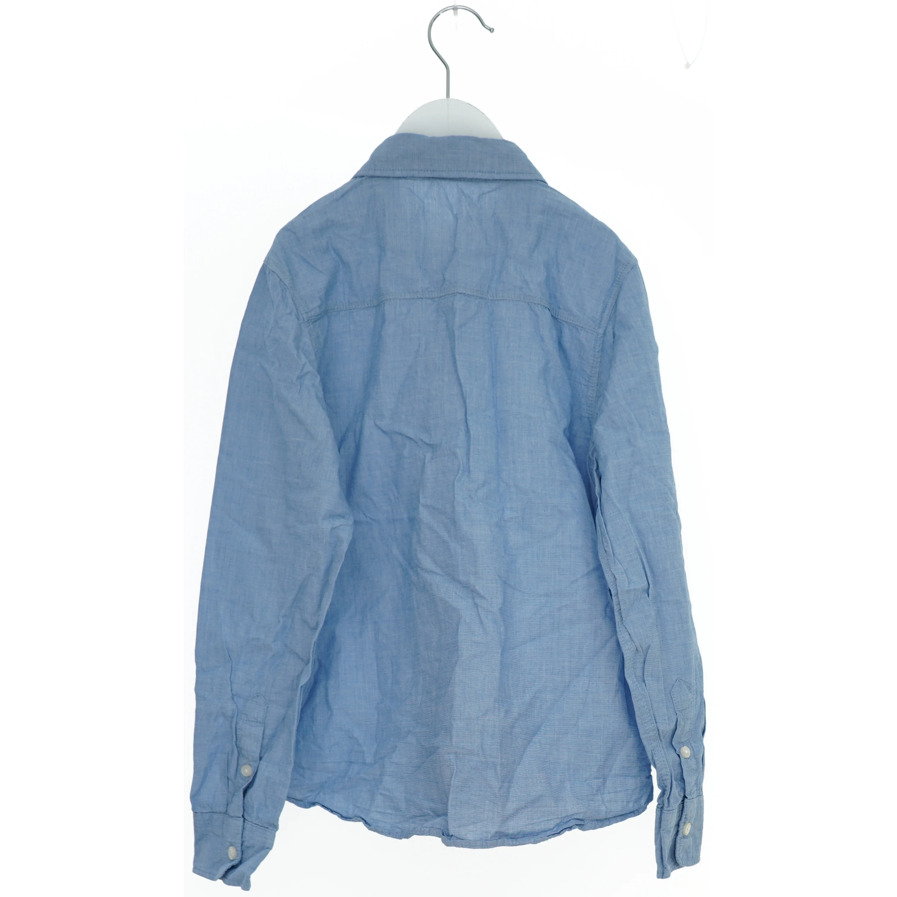 Blå skjorte med lange ærmer fra H&M (str. 134)