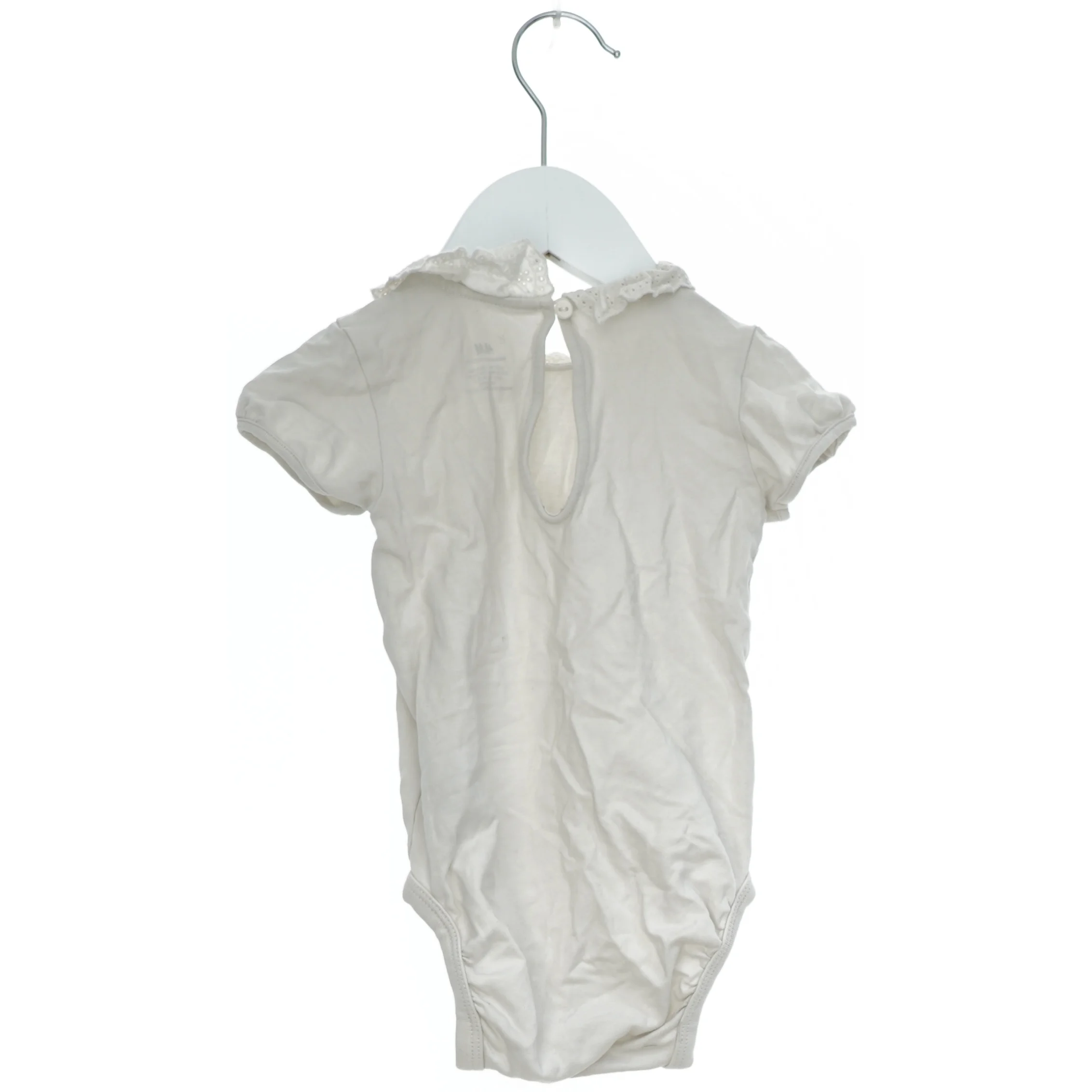 Hvid bodystocking med krave fra H&M (str. 74)