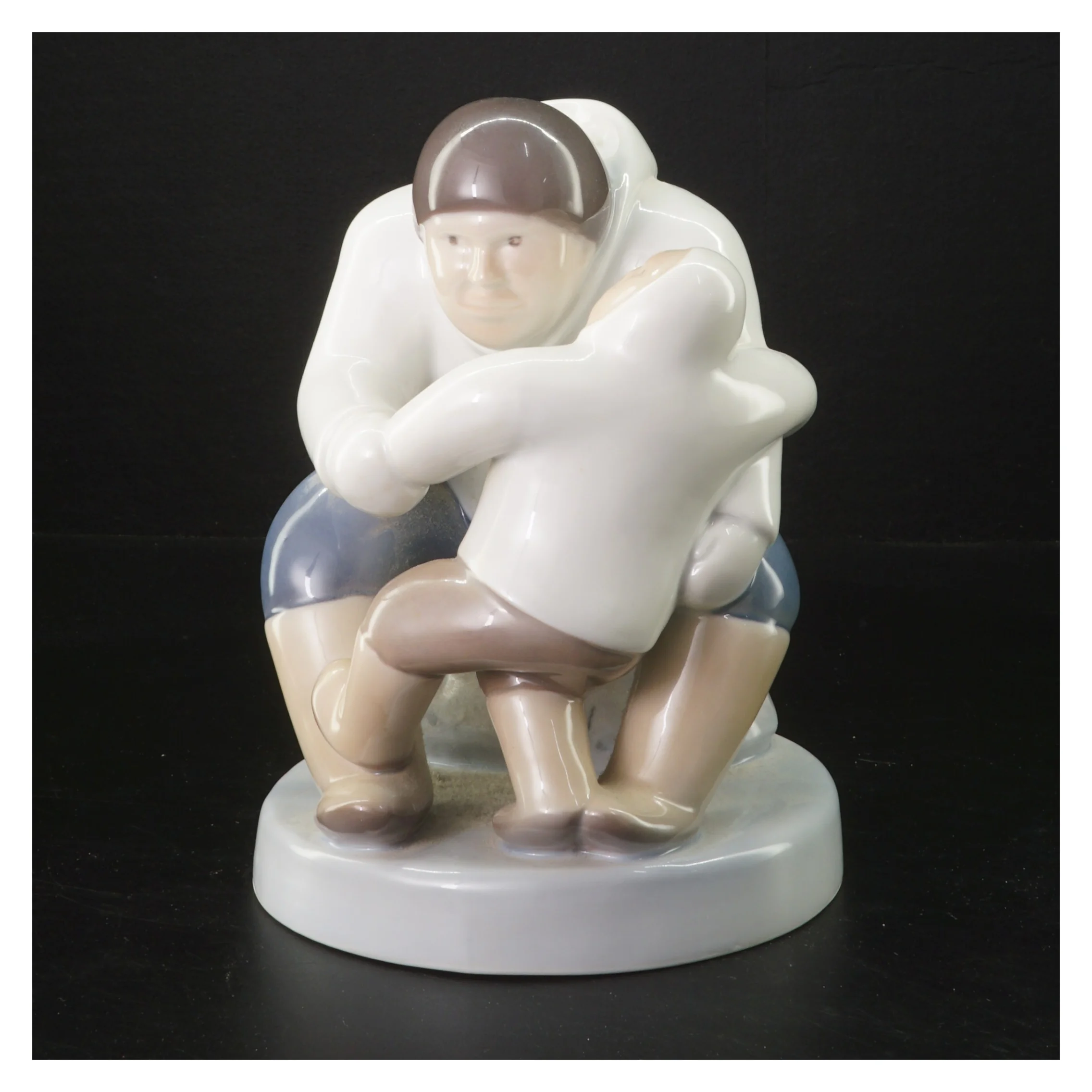 Porcelænsfigur af far med barn fra B&G (str. 21 cm)