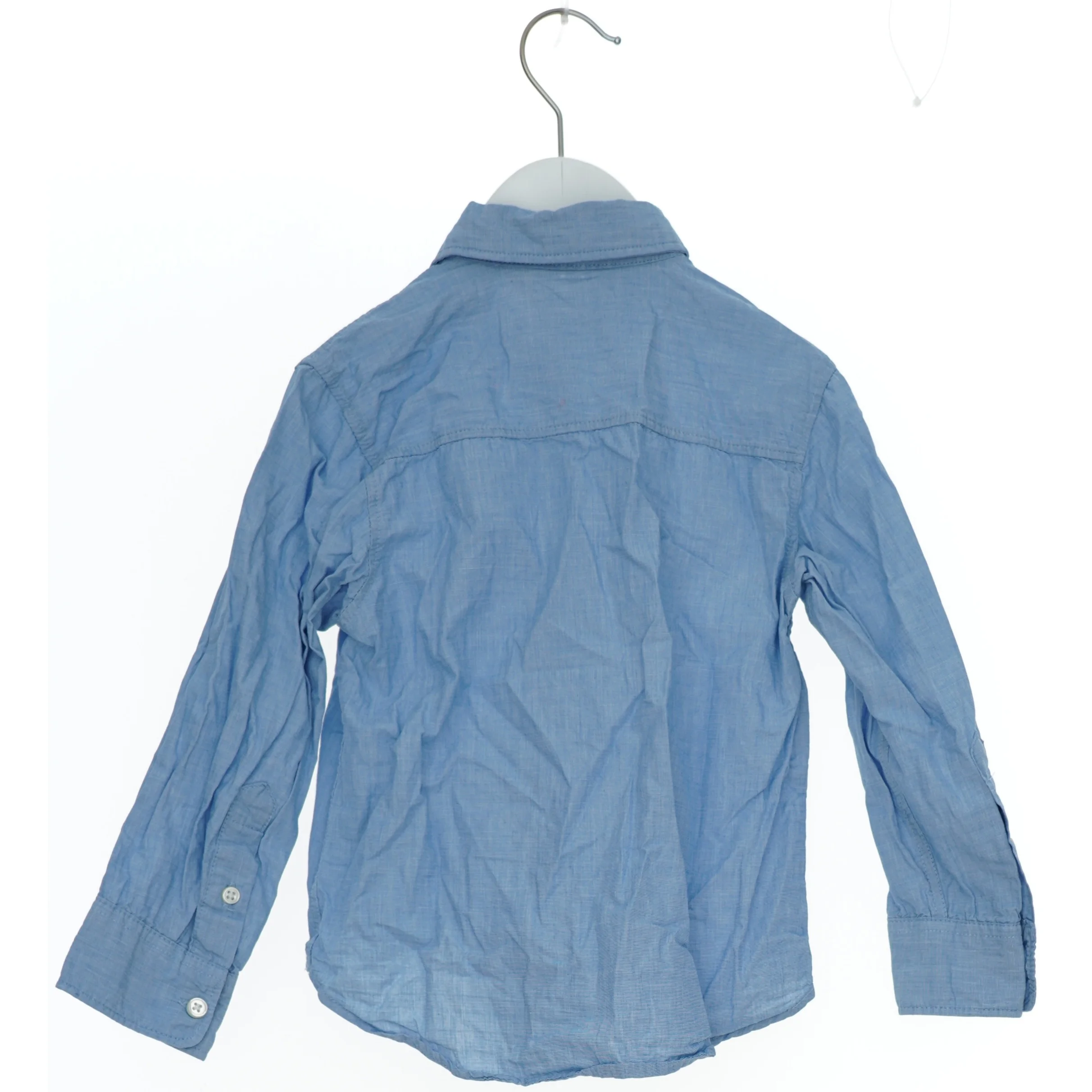 Lyseblå langærmet skjorte fra H&M (str. 104)