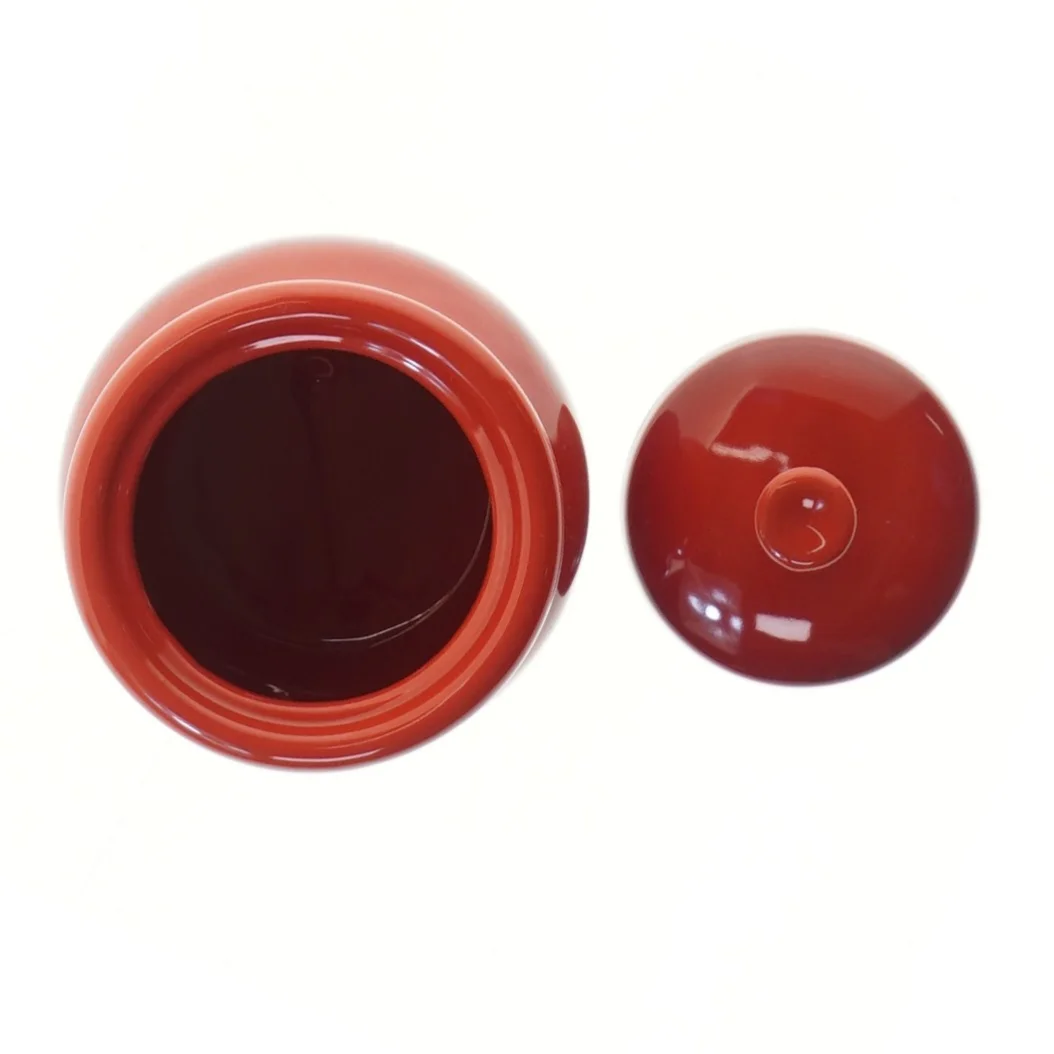 Rød keramisk krukke med låg fra Cook & Baker til bl.a hvidløg (str. 10 cm)