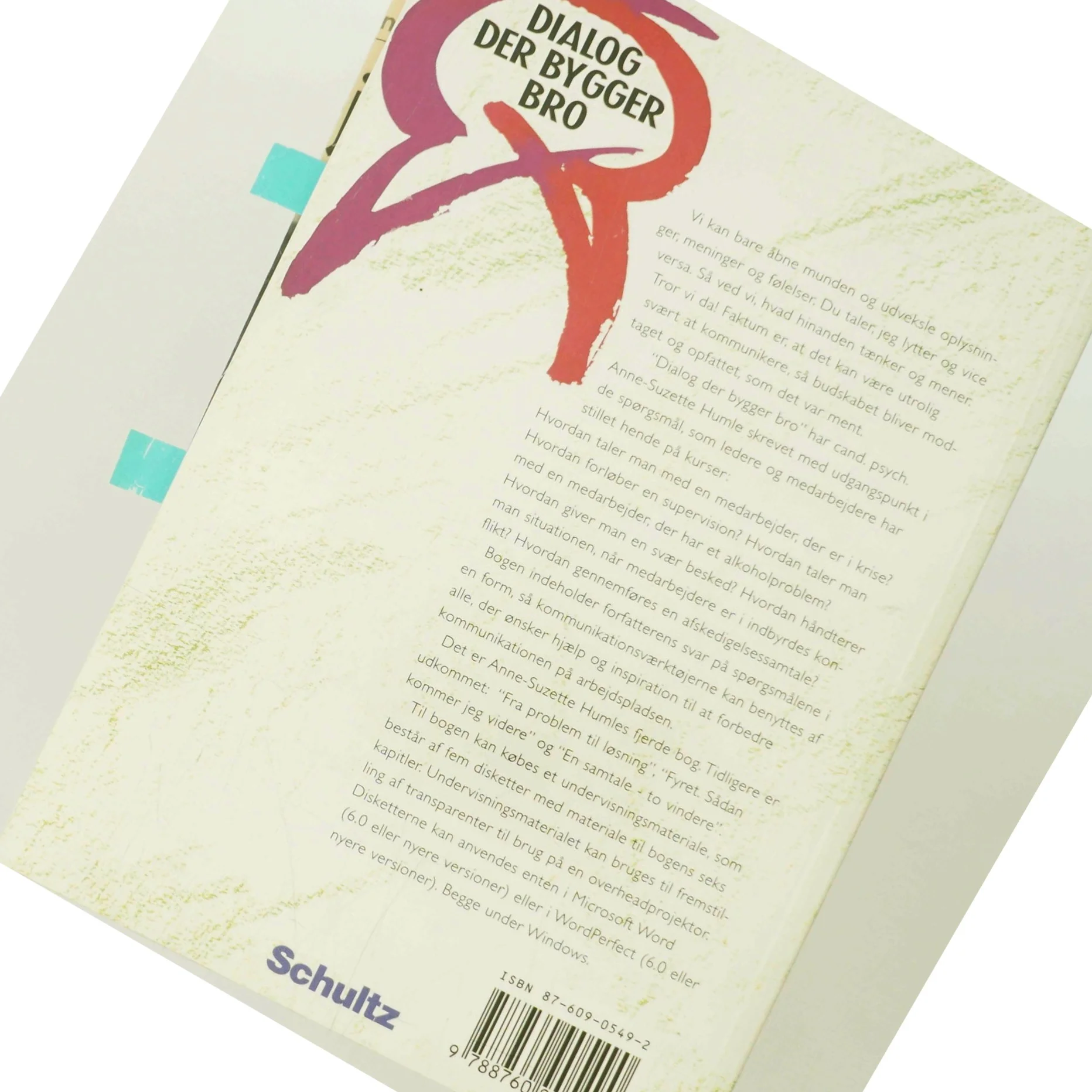 Dialog der bygger bro : metoder til konstruktive samtaler på arbejdspladsen af Susse Humle (Bog)