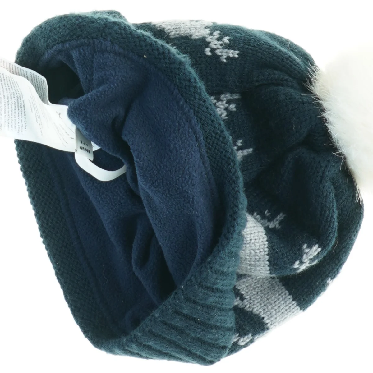 Strikhue med pompon og rensdyrmønster (str. Et til 2 år)