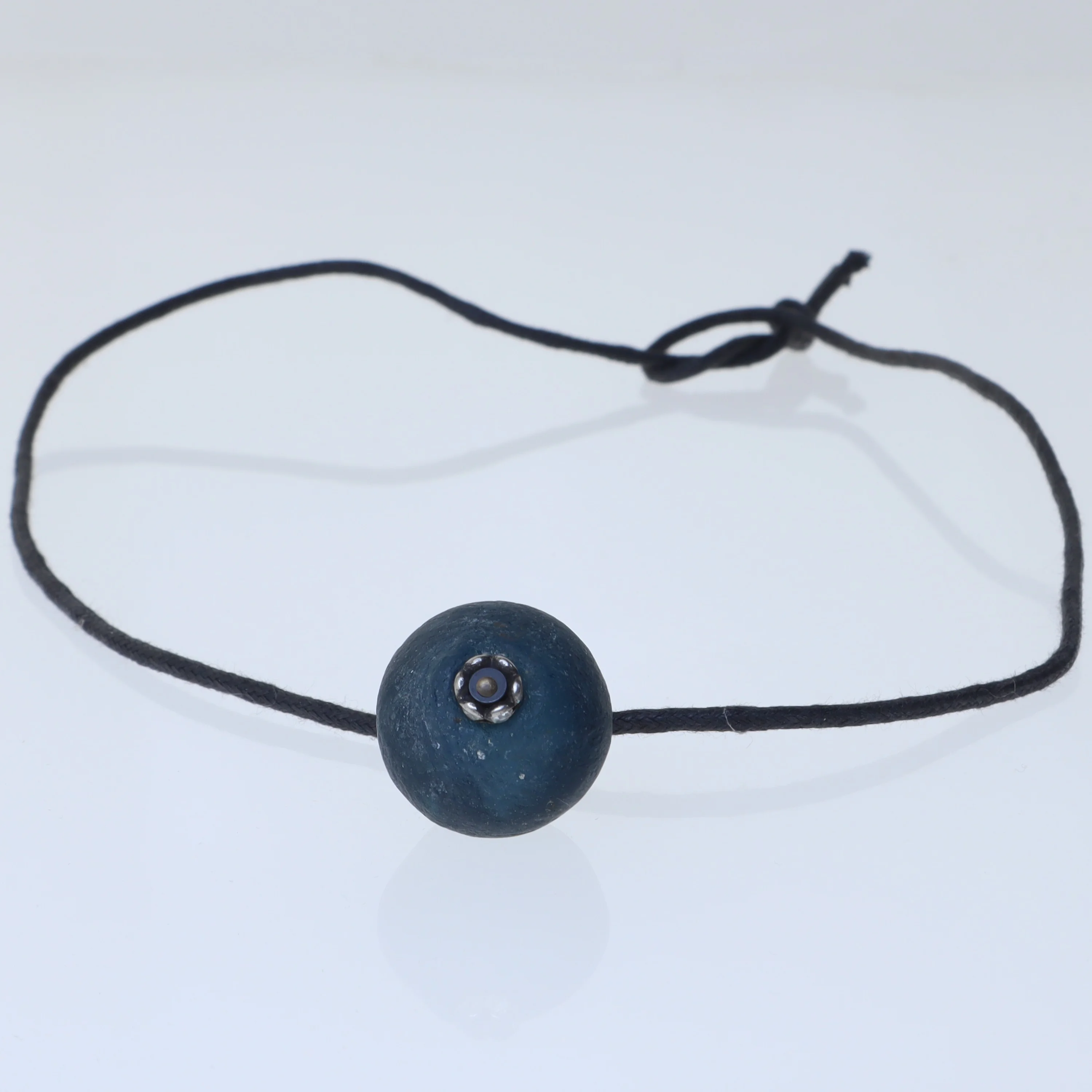 Simple black cord necklace with blue pendant (str. 60 cm)