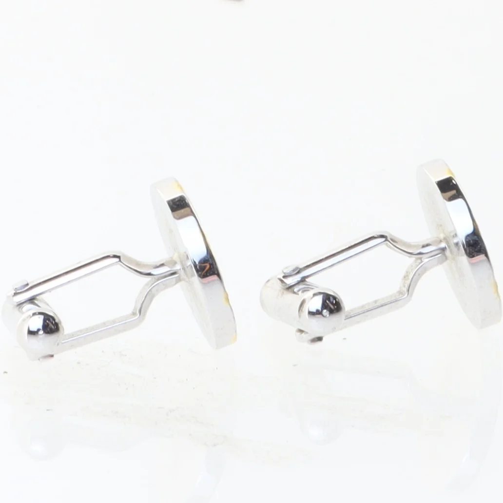 Manchetknapper med uremotiv (str. 1,5x1,7 cm)