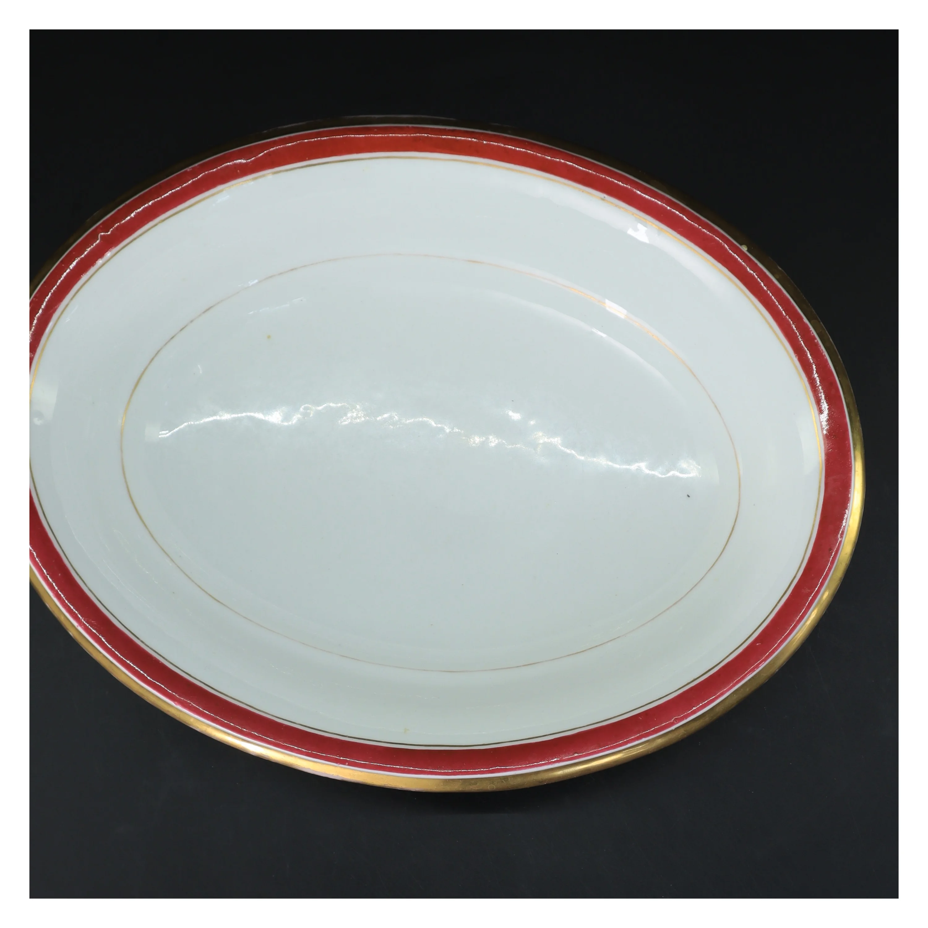 Oval porcelænsskål med guldkant (str. 32 cm)