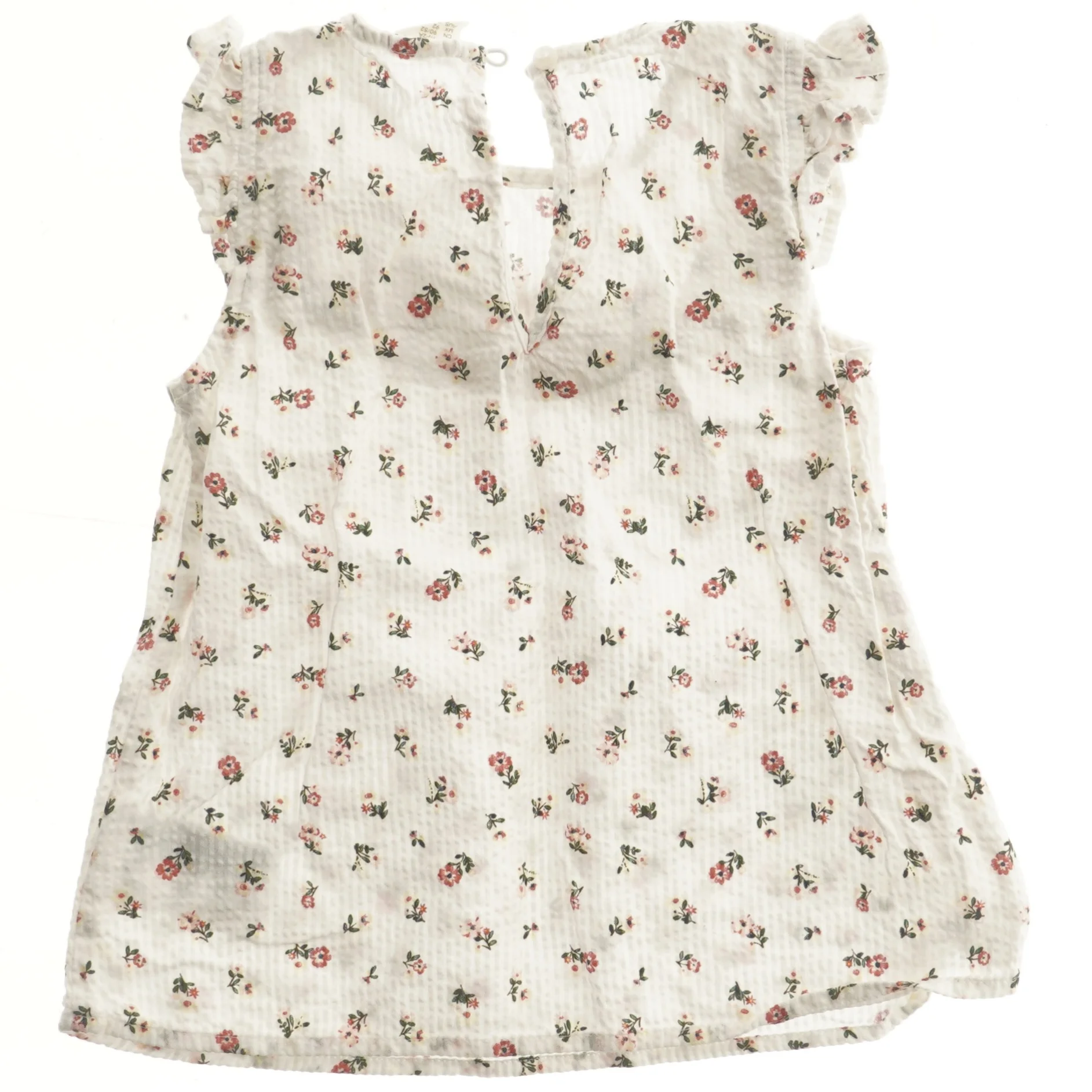 Blomstret bluse med flæser fra H&M (str. 92)