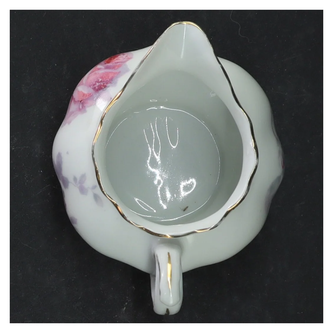 Porcelænsflødekande med blomstermotiv (str. 7,5x9 cm)