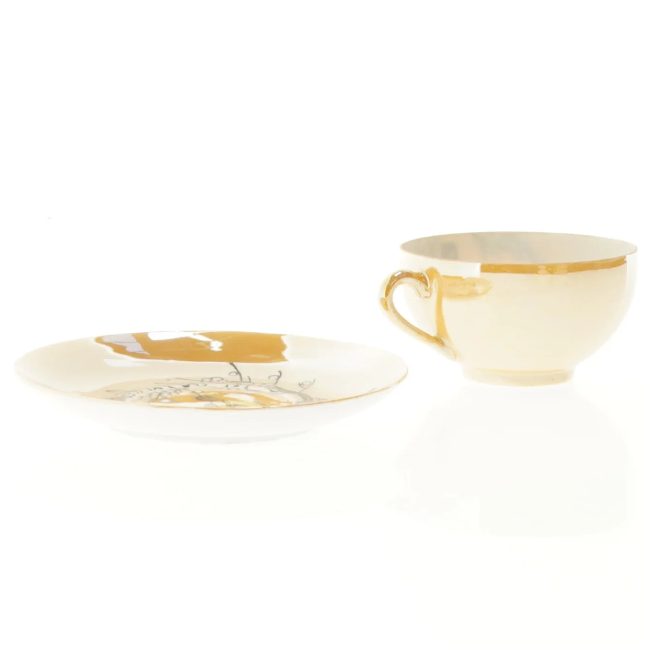 Mokkakop med ansigt i bunden 