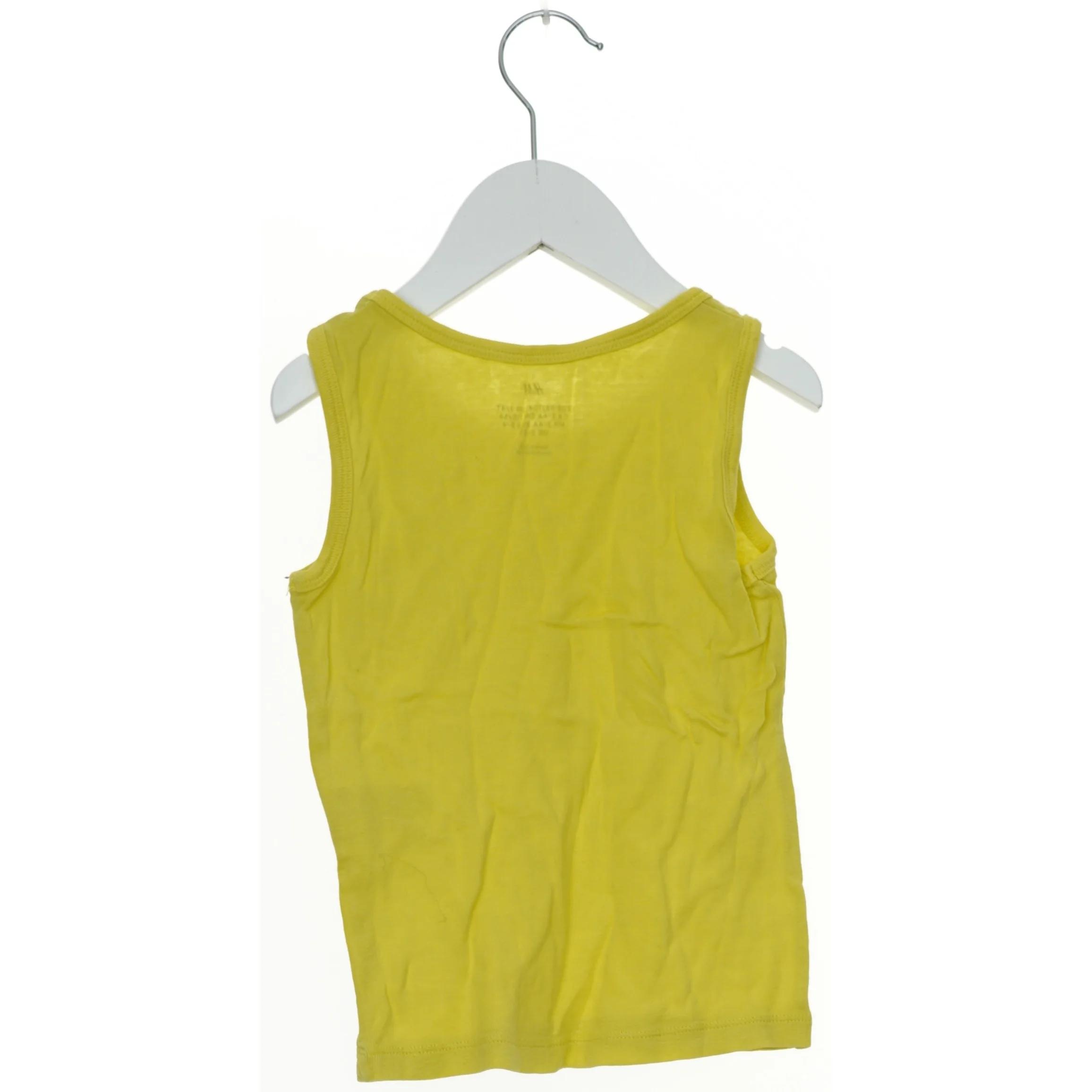 Gul tanktop fra H&M (str. 104)