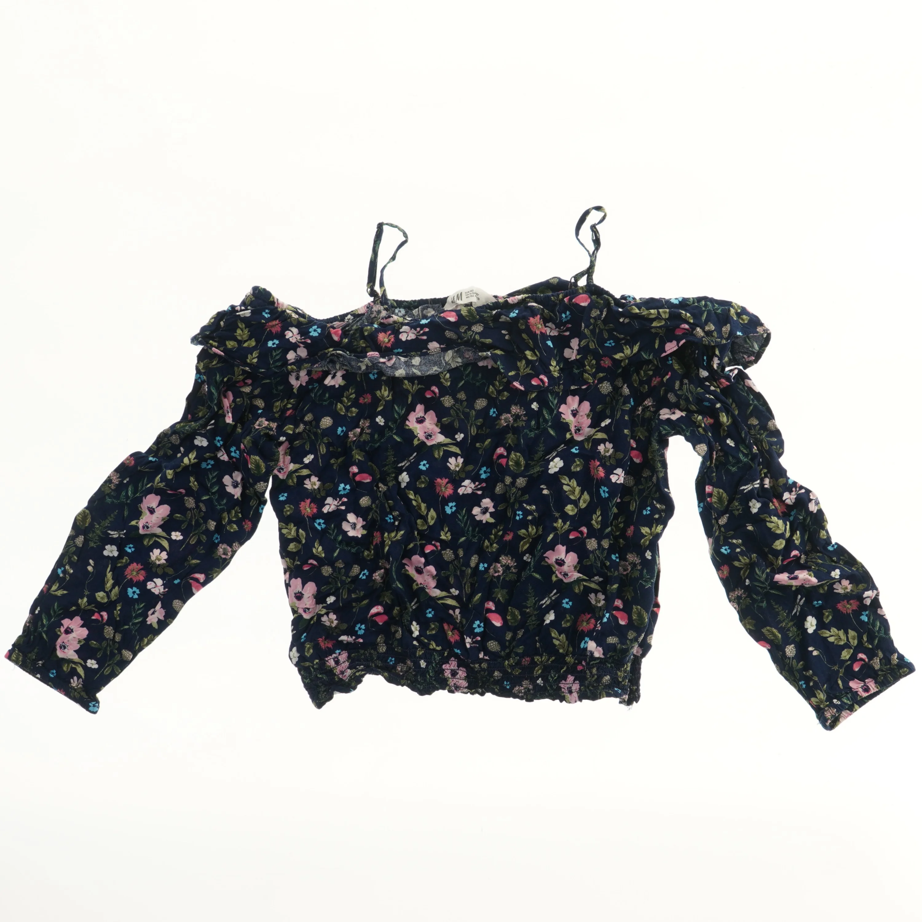 Bluse med blomsterprint fra H&M (str. 152)