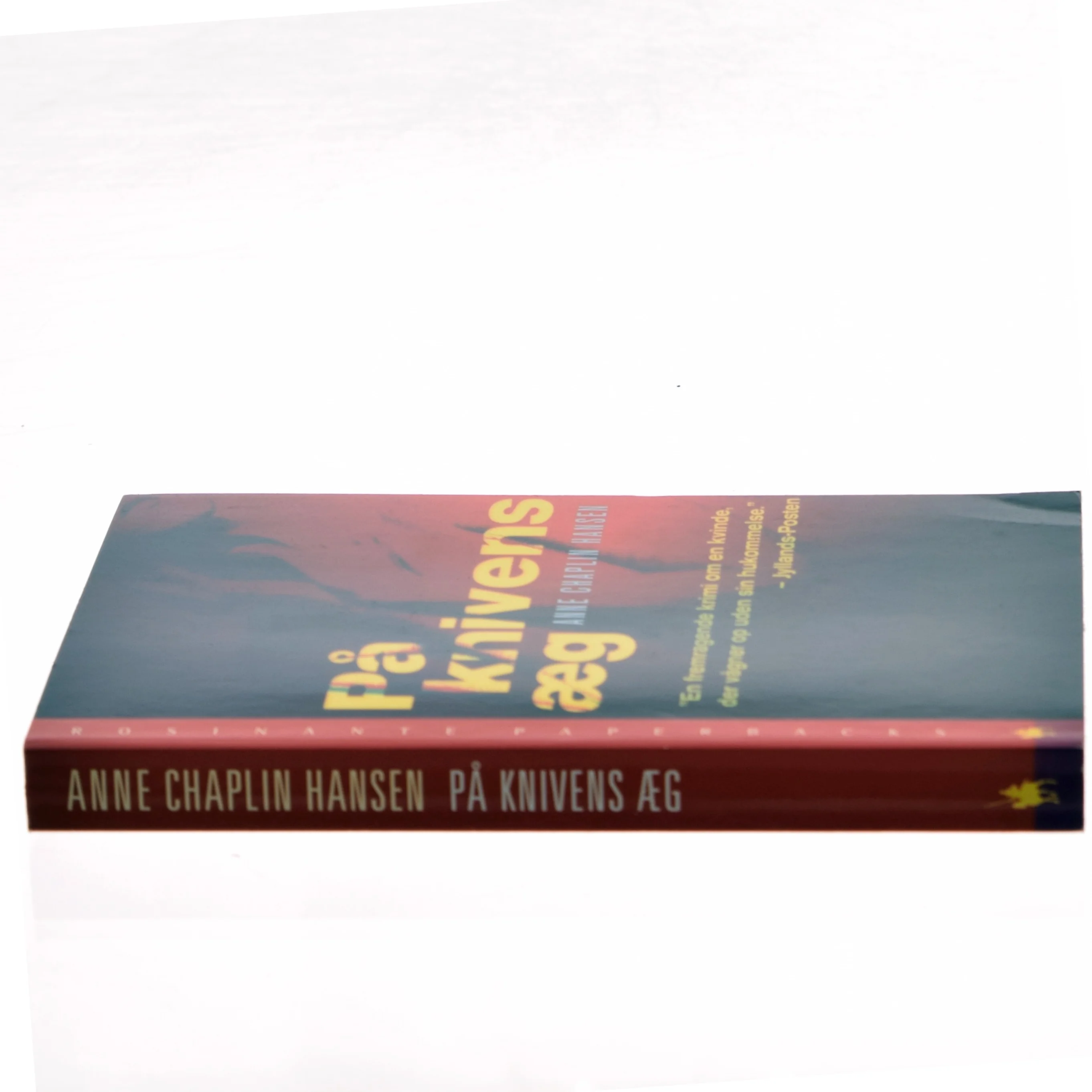 På knivens æg : roman af Anne Chaplin Hansen (Bog)