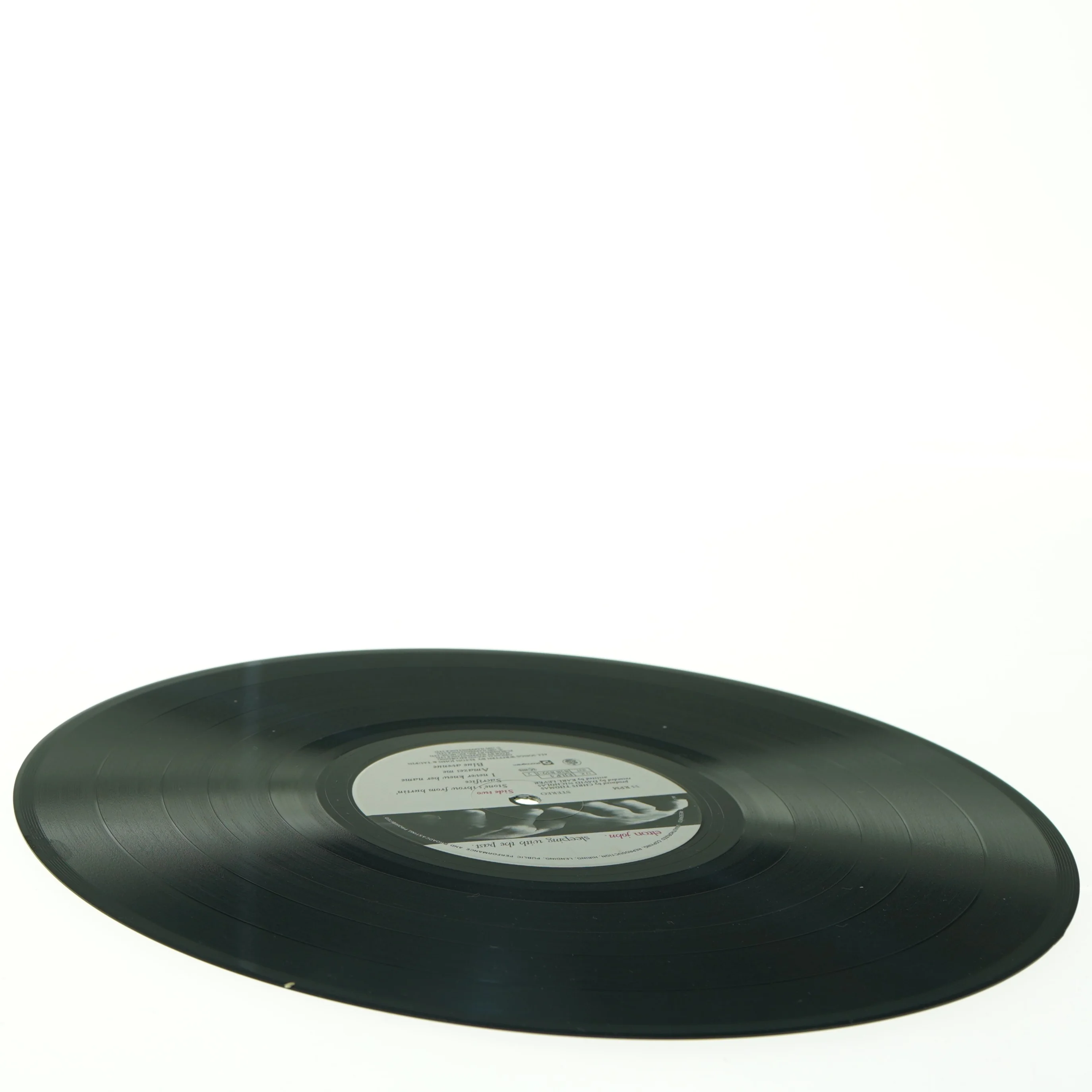 Elton John "Sleeping with the past" LP (str. 31 x 31 cm)