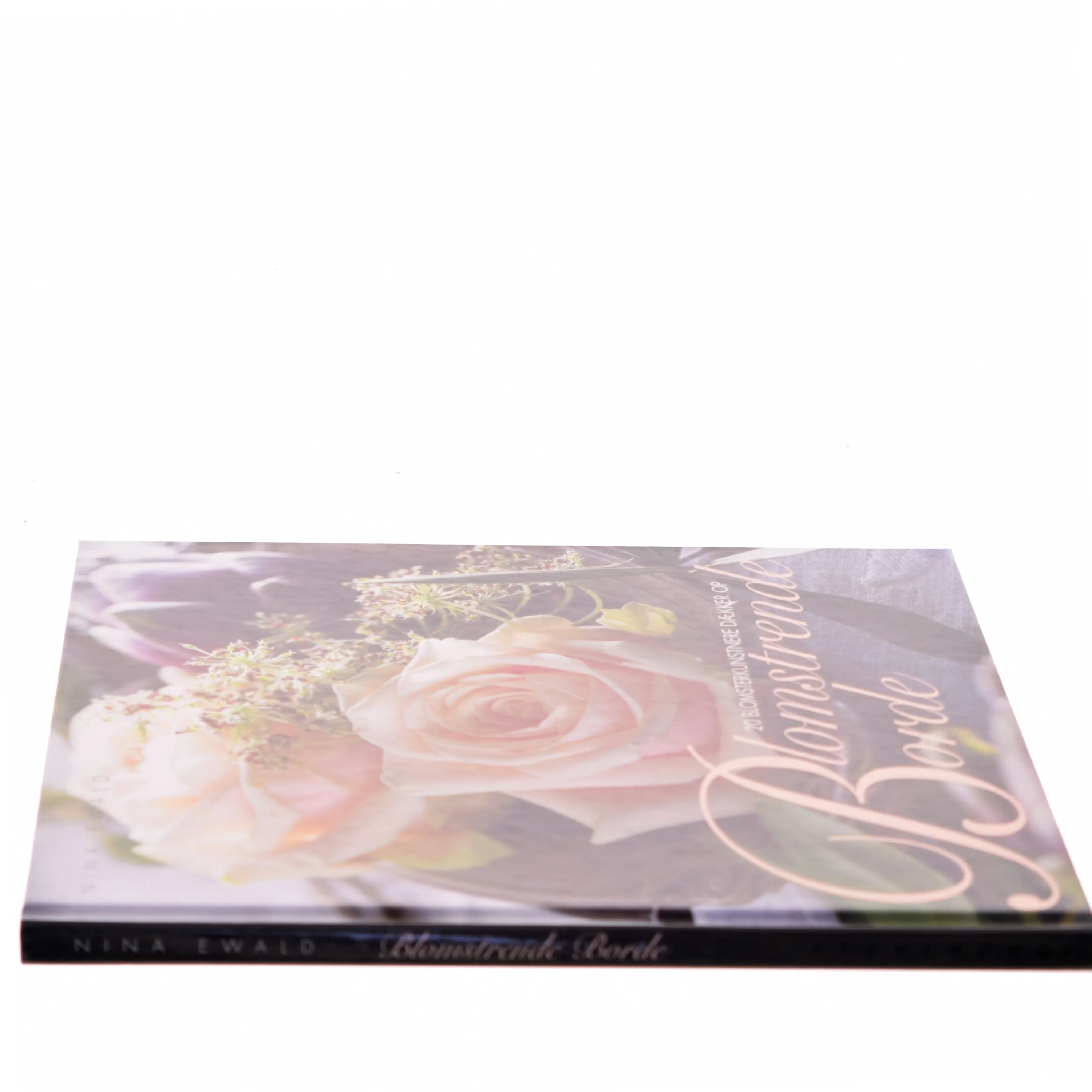 Blomstrende borde : 20 blomsterkunstnere dækker op af Nina Ewald (Bog)