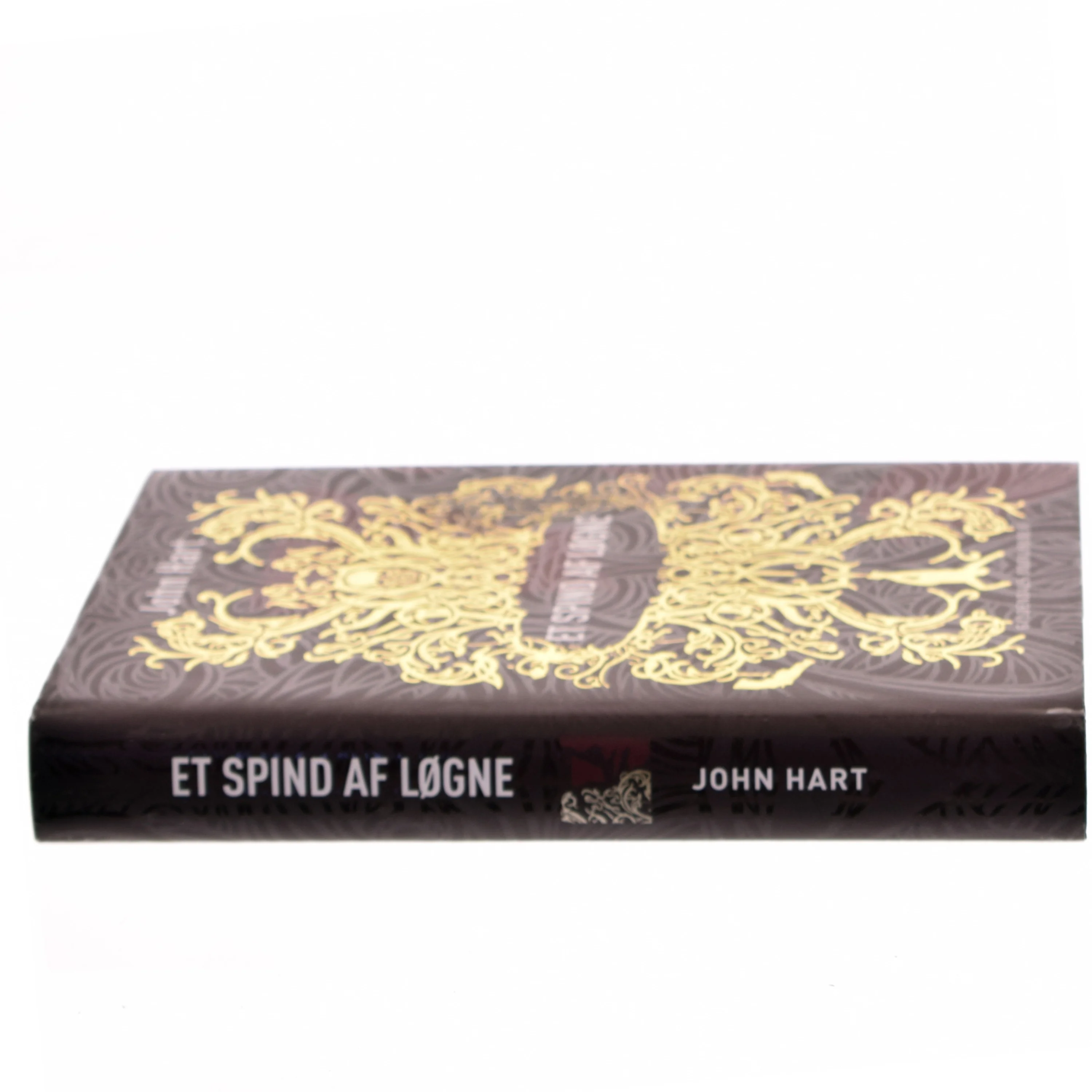 Et spind af løgne af John Hart (f. 1965) (Bog)