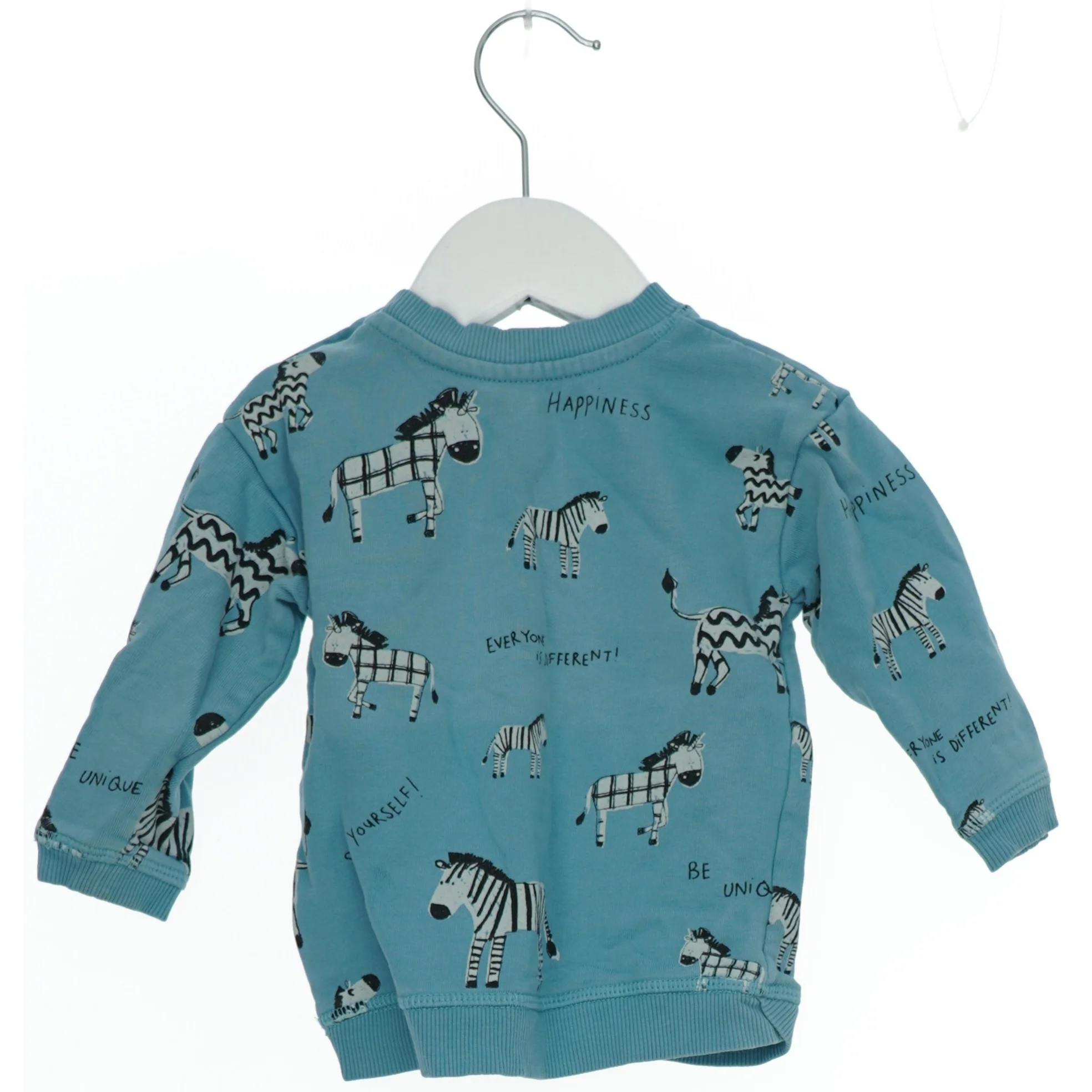 Langærmet bluse med zebra design fra H&M (str. 74)