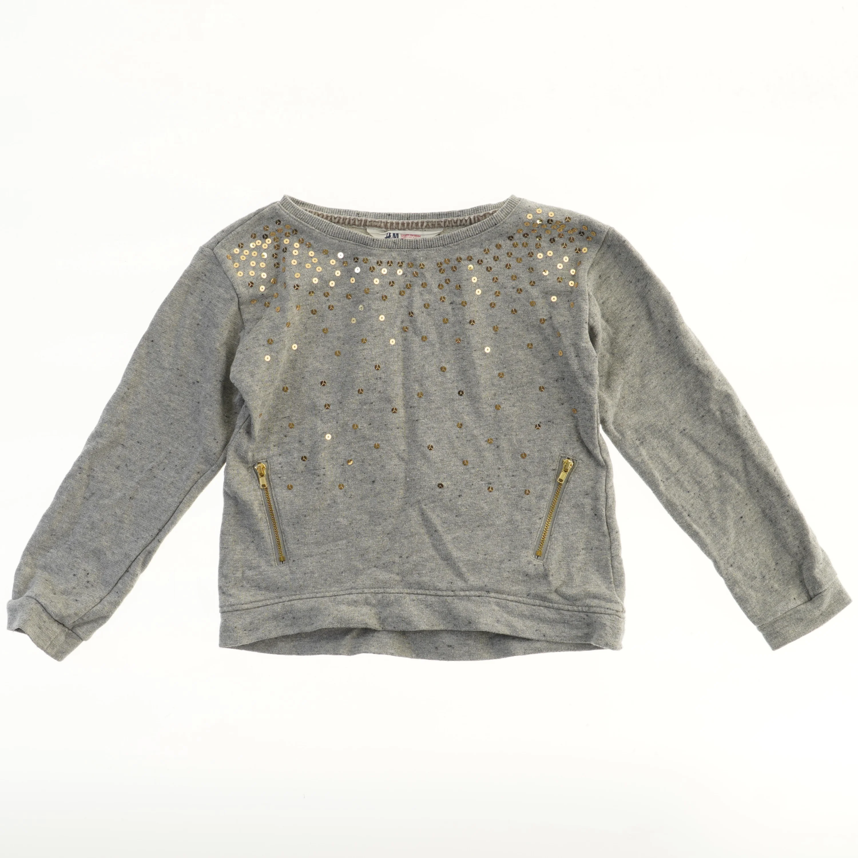 Grå trøje med pailletter fra H&M (str. 122)