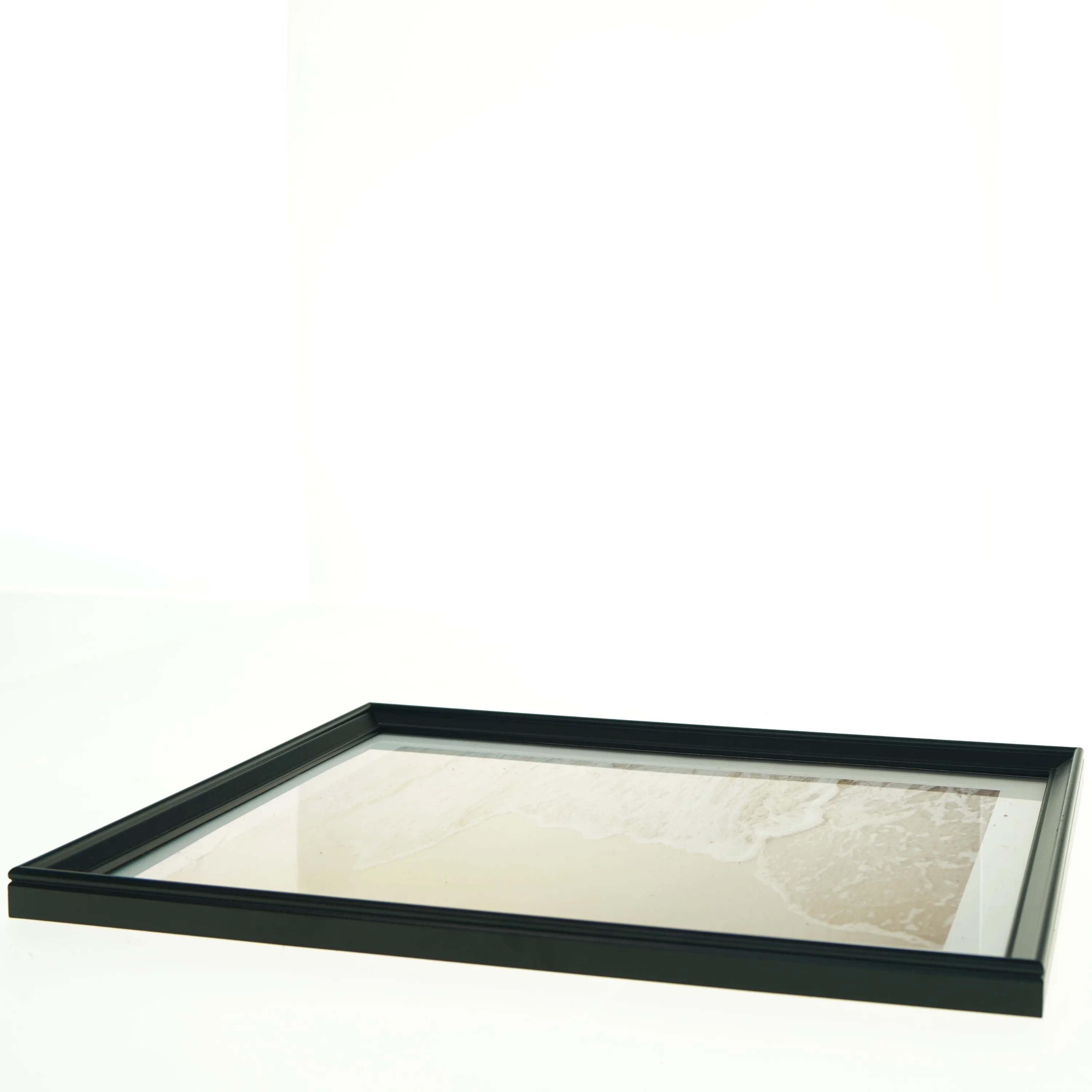 Indrammet billede med strandmotiv fra IKEA (str. 33 x 43 cm)