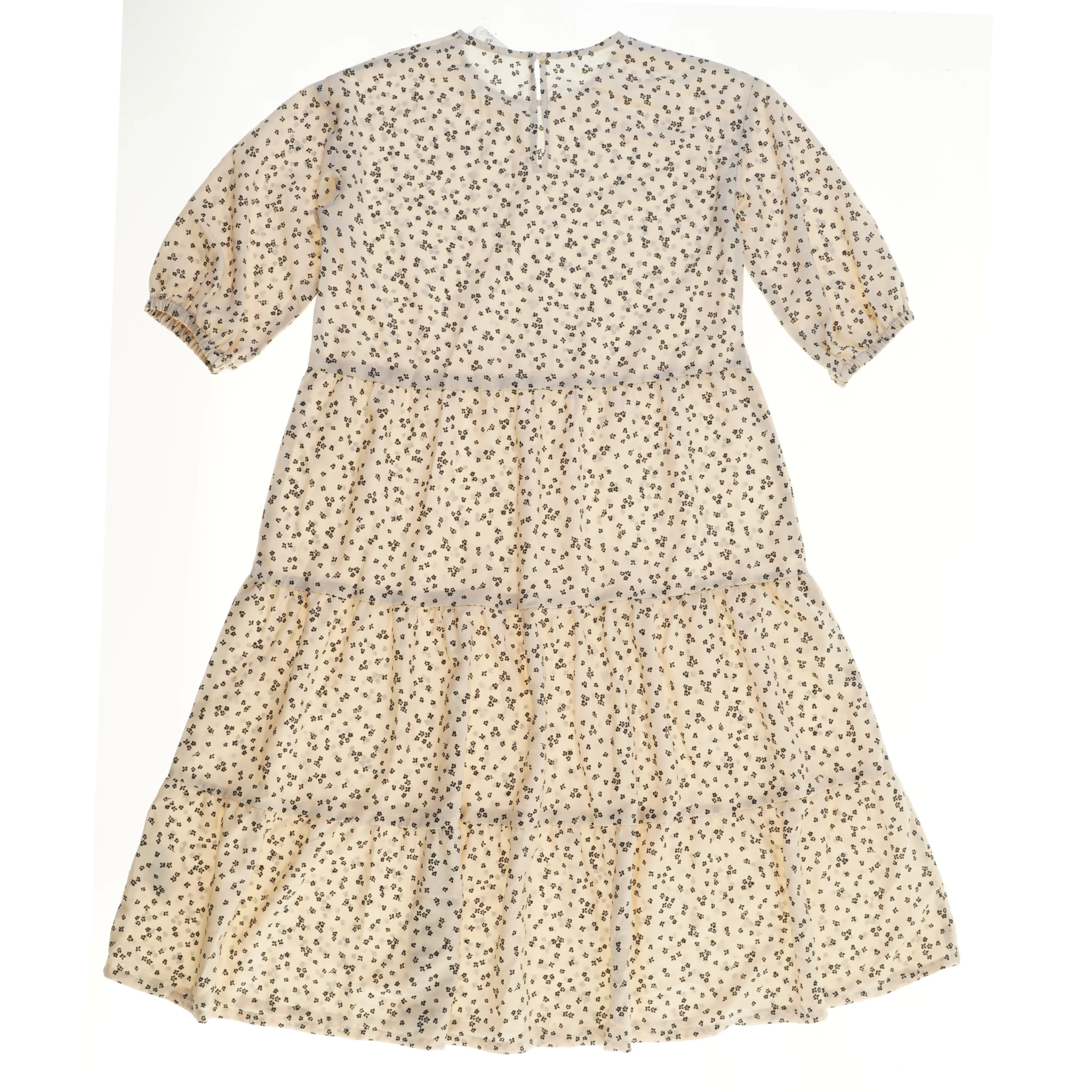 Langærmet kjole med blomsterprint fra H&M (str. 152)