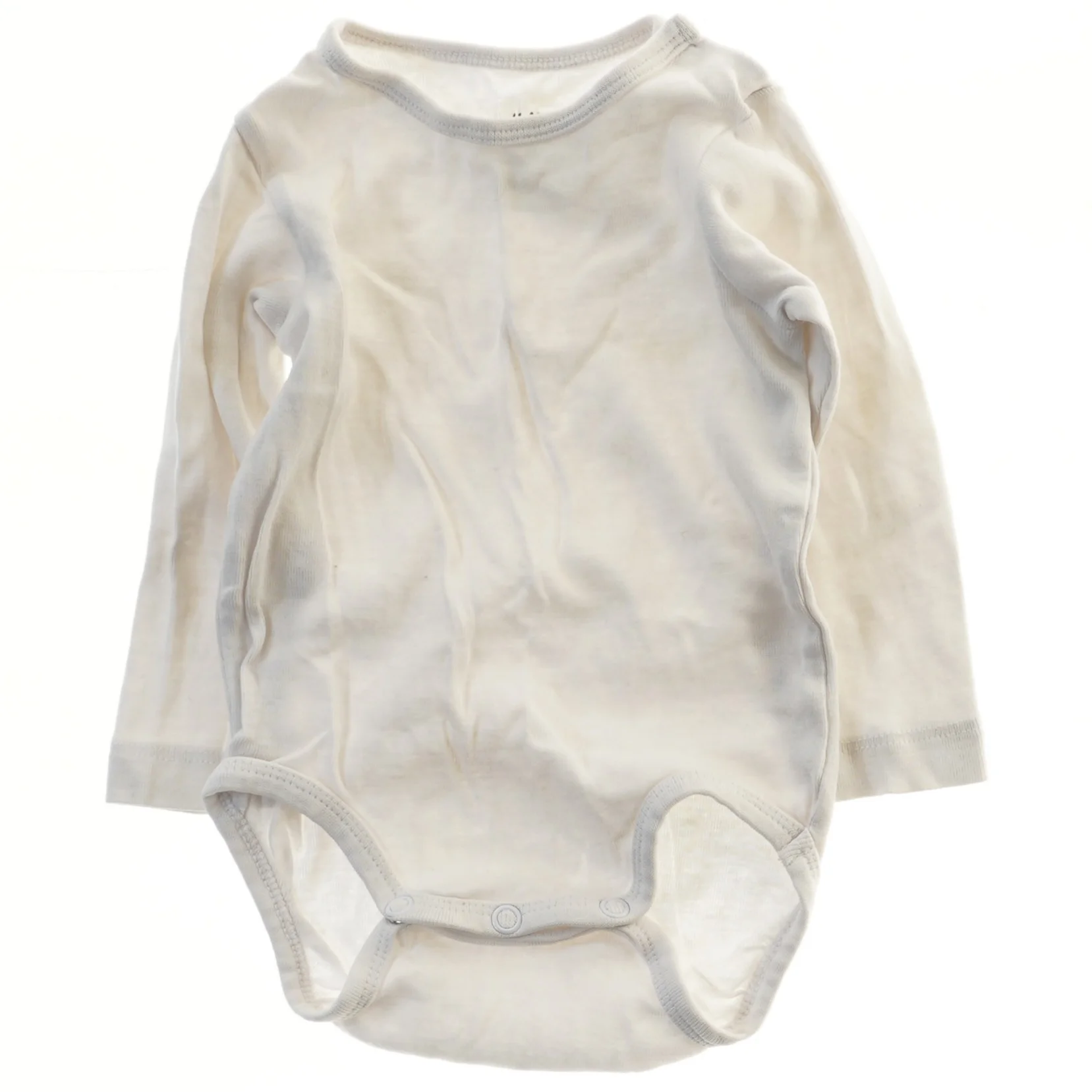 Hvid langærmet bodystocking til baby fra H&M (str. 68)